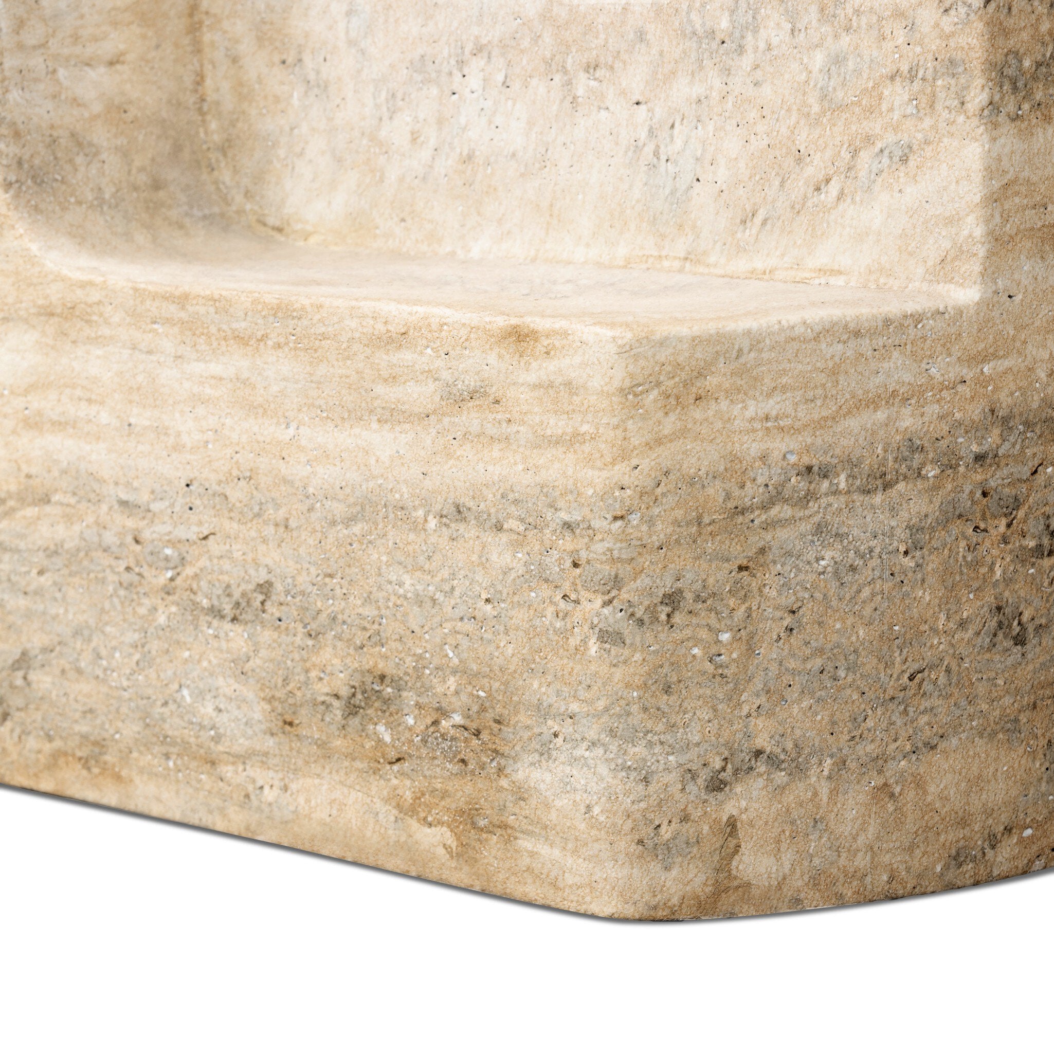 Close-up of a faux stone beige side table with visible texture.