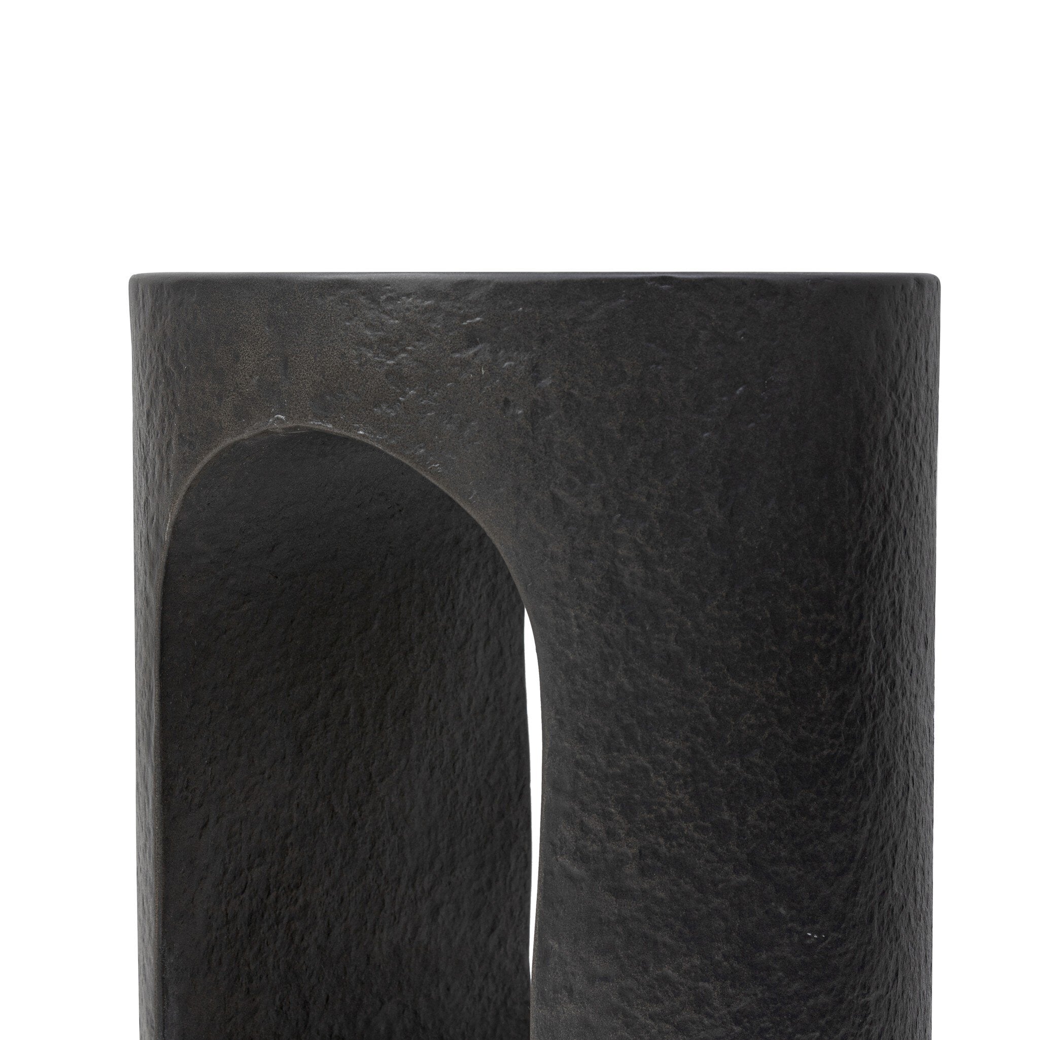 Black concrete end table with pill-shaped cutout