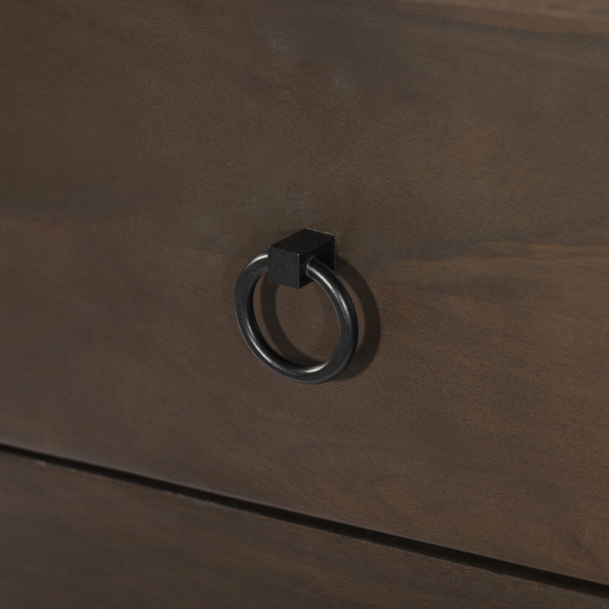 Dark brown wooden drawer with a metal ring handle