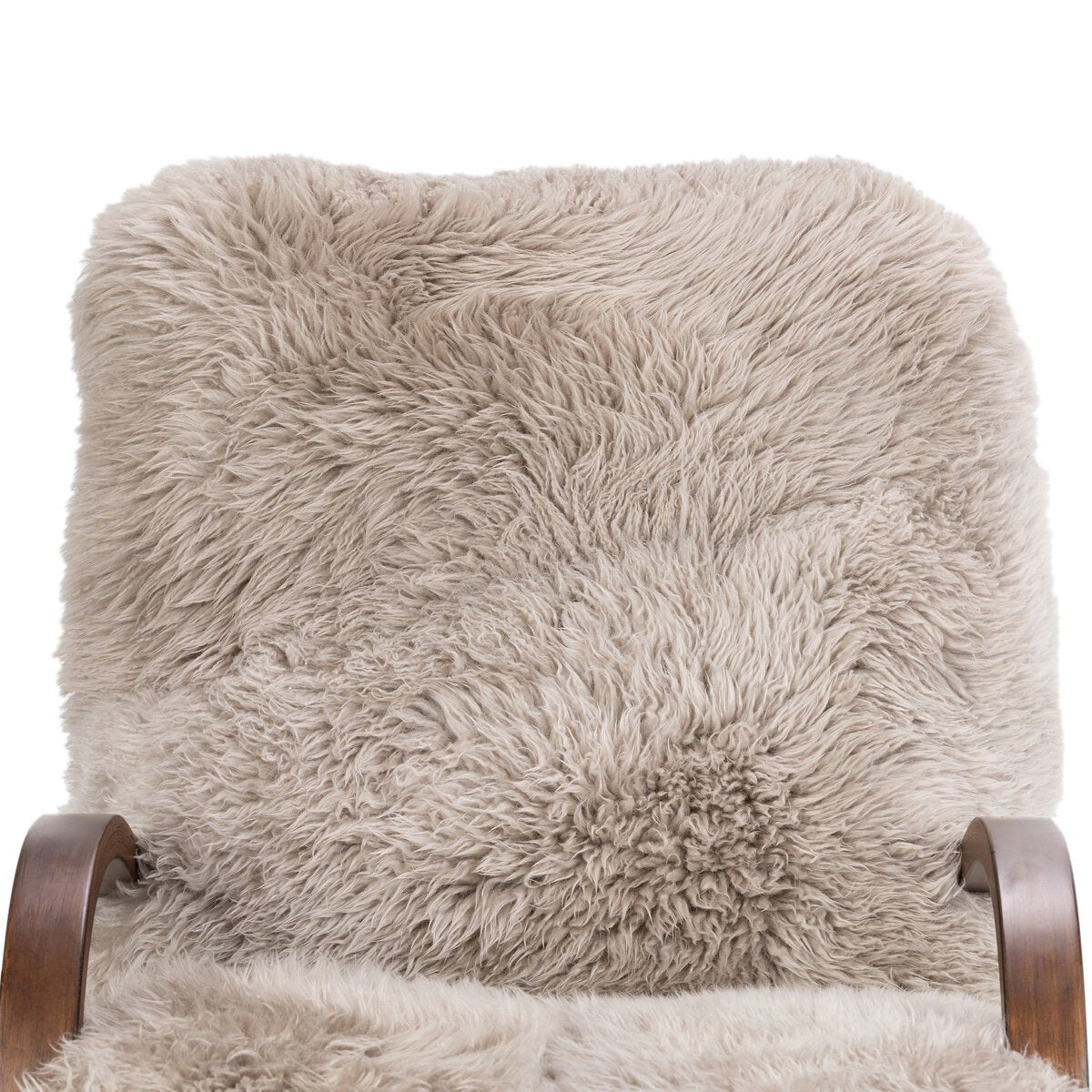 Fluffy beige throw blanket on a wooden chair with a white background