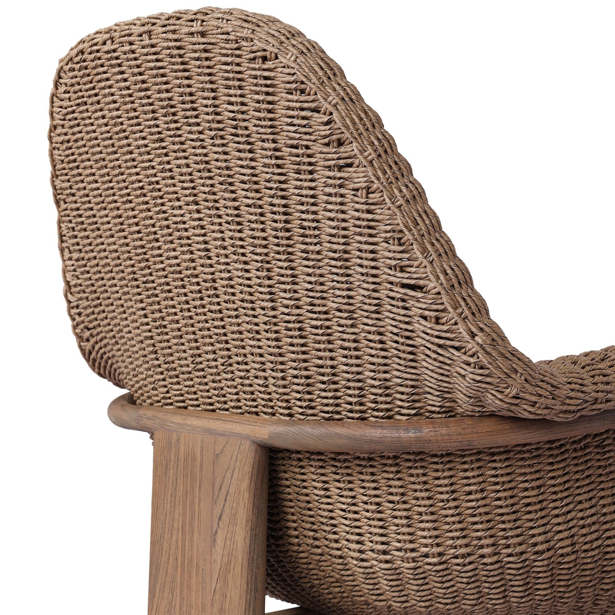 Close-up of a wicker chair with wooden armrests on a white background