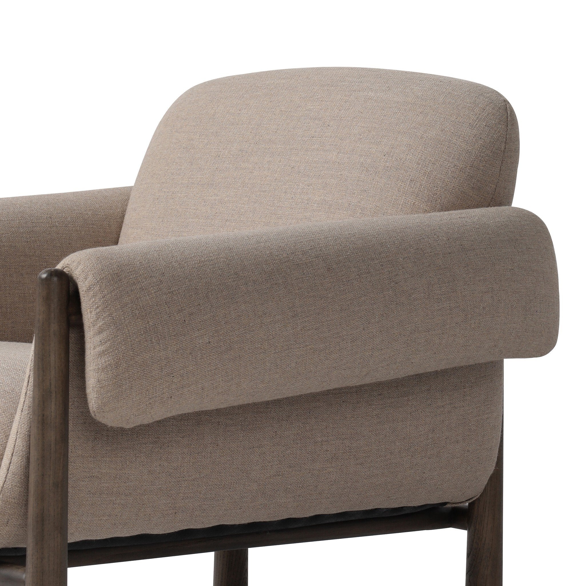 Beige armchair with wooden armrests on a white background