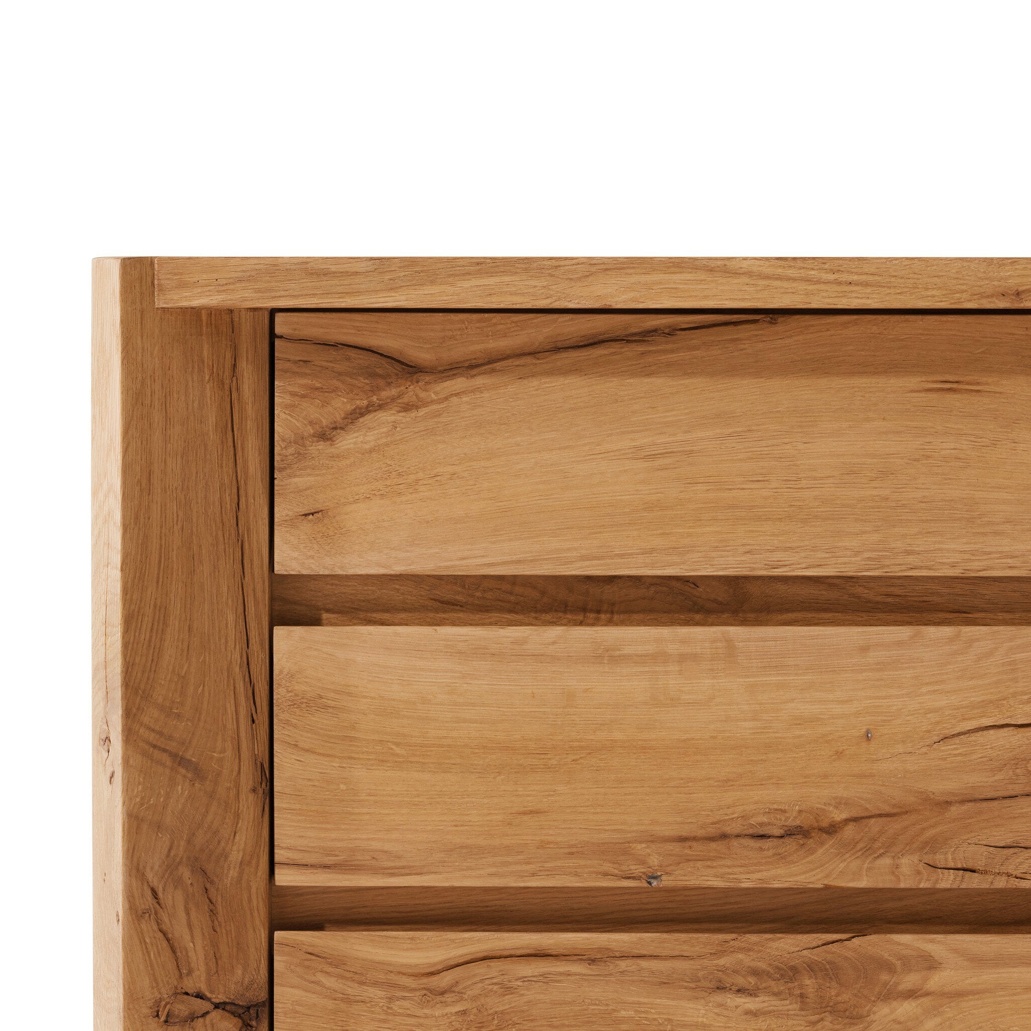 Close-up of a wooden drawer with a visible grain pattern on a white background