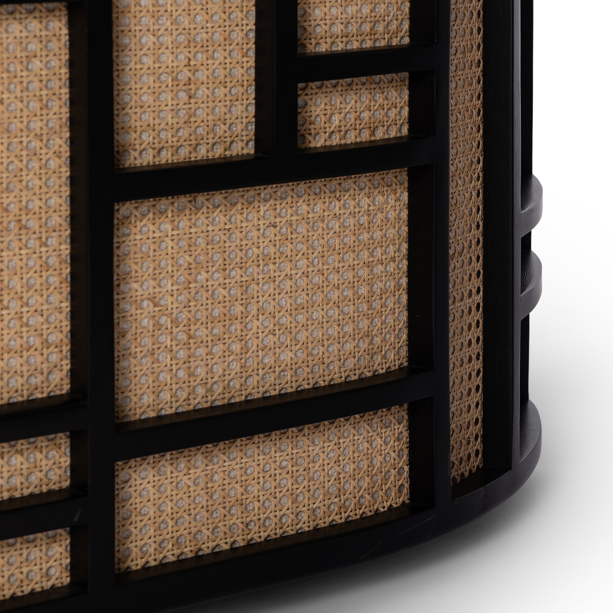 Close-up of a textured cylindrical object with geometric pattern on a white background