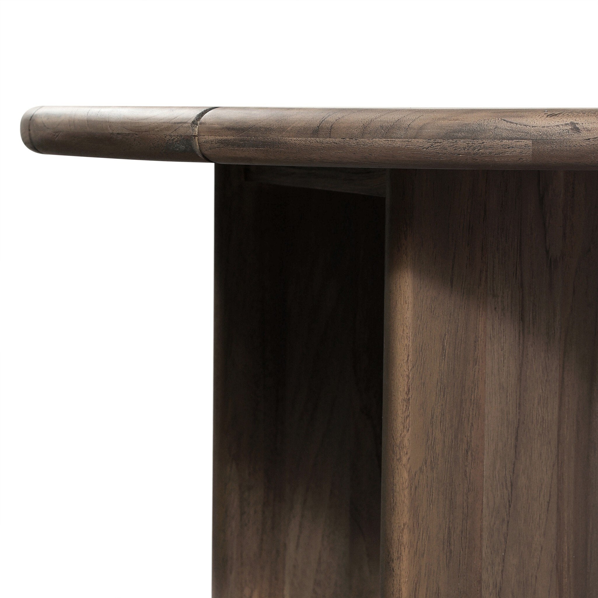 Close-up of a wooden table corner with a white background