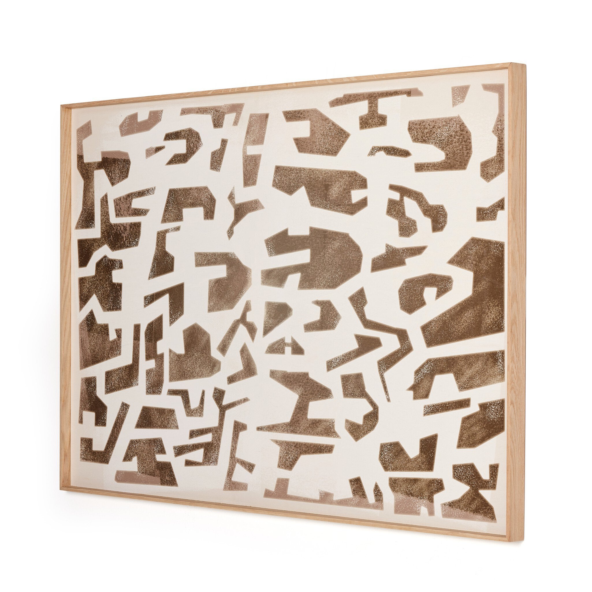 Abstract wall art with brown cut-out shapes on a white background