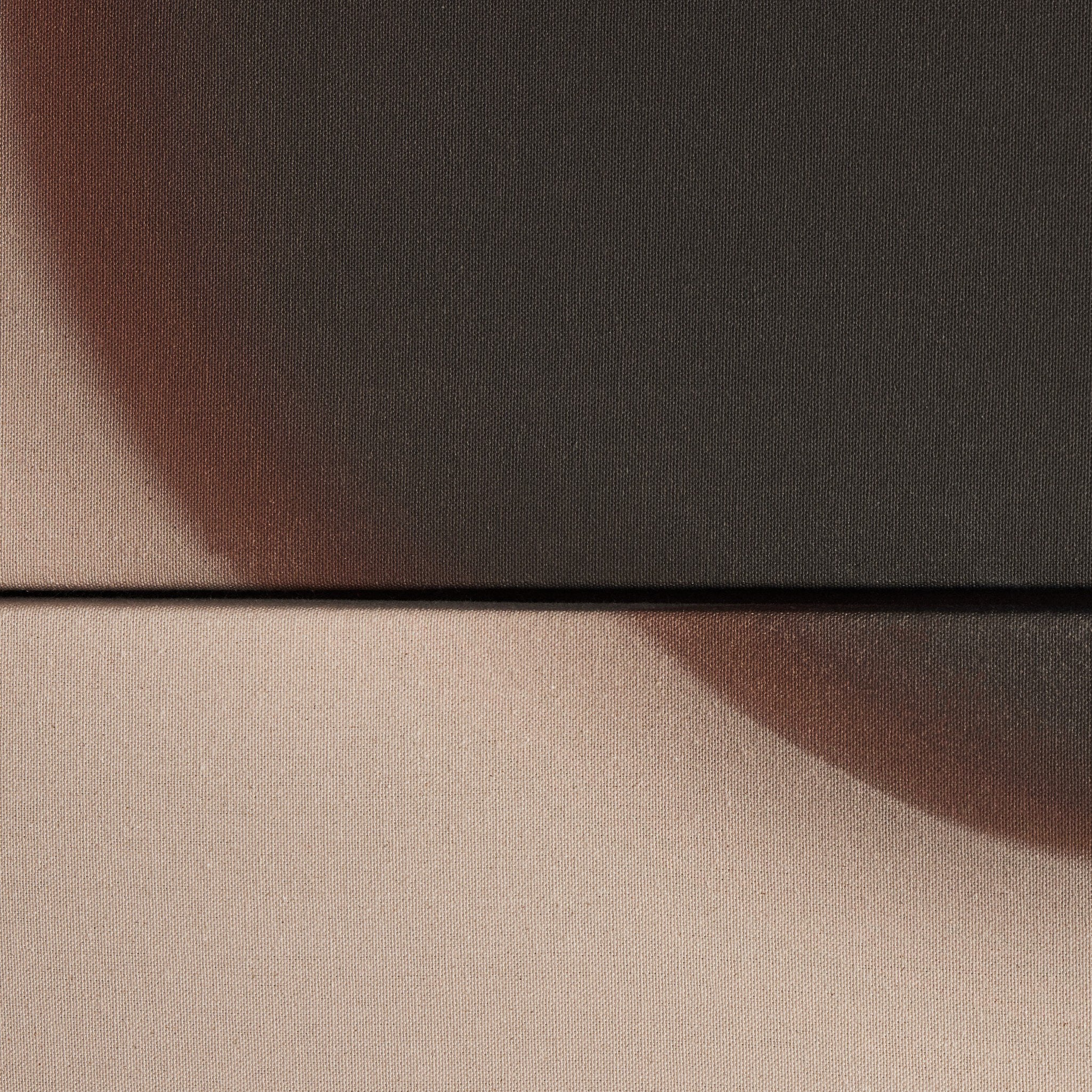 Two fabric swatches, one brown and one beige, on a black background.