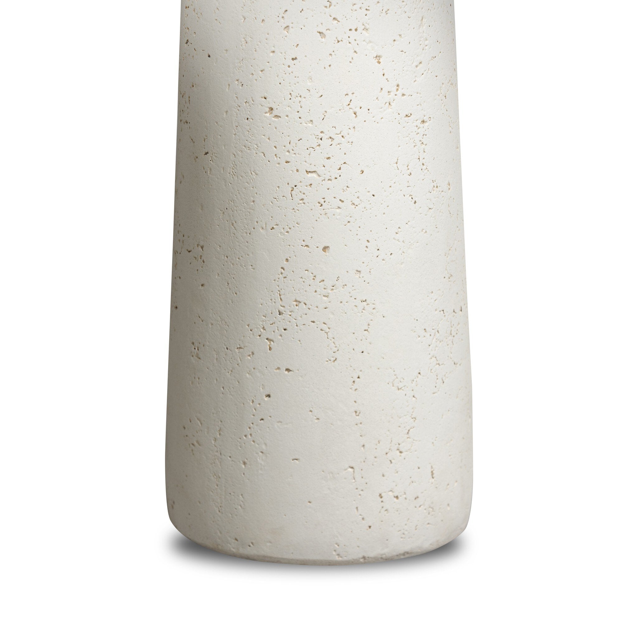 White concrete nesting table leg with textured surface on a white background
