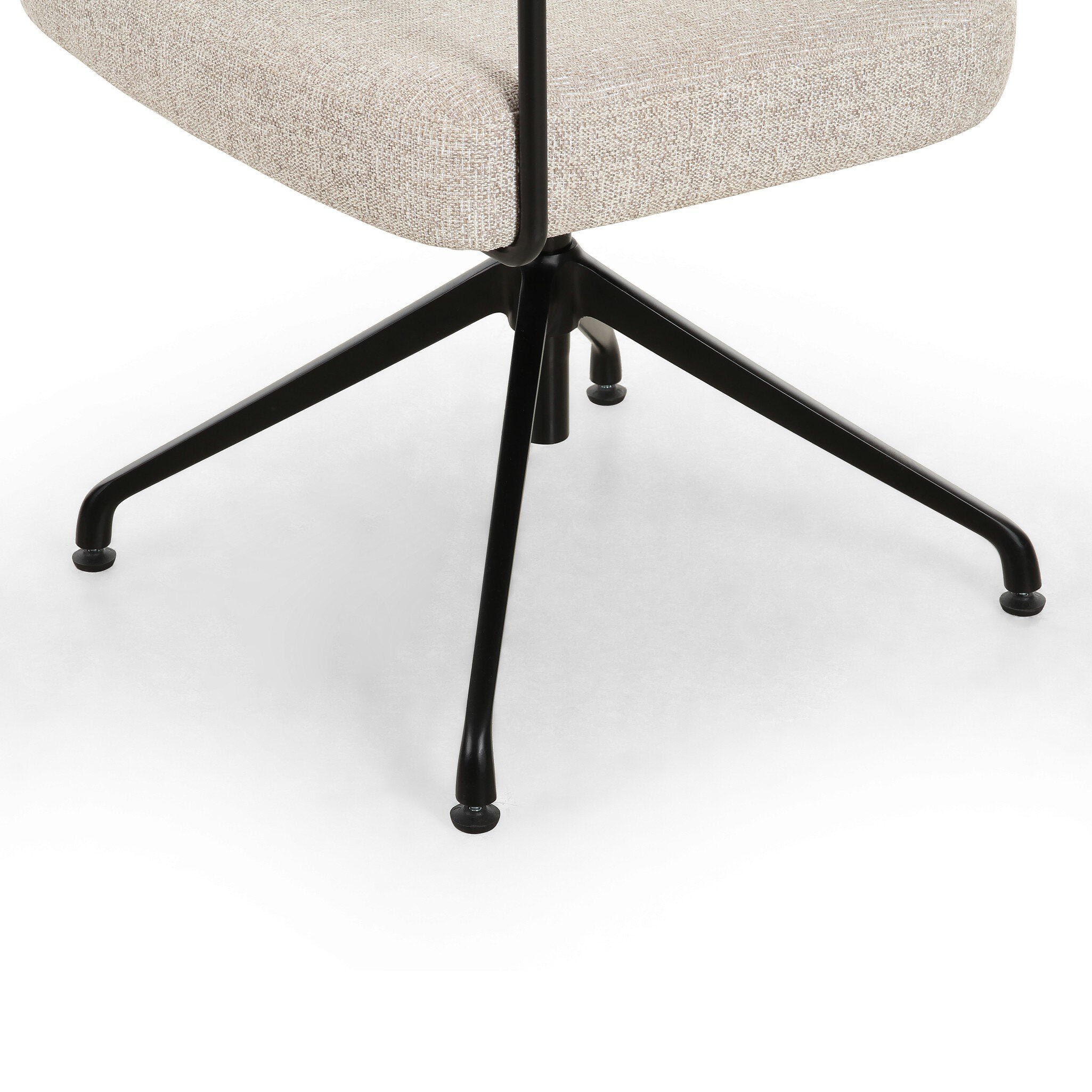 Chair with beige cushioned seat and black metal legs on a white background