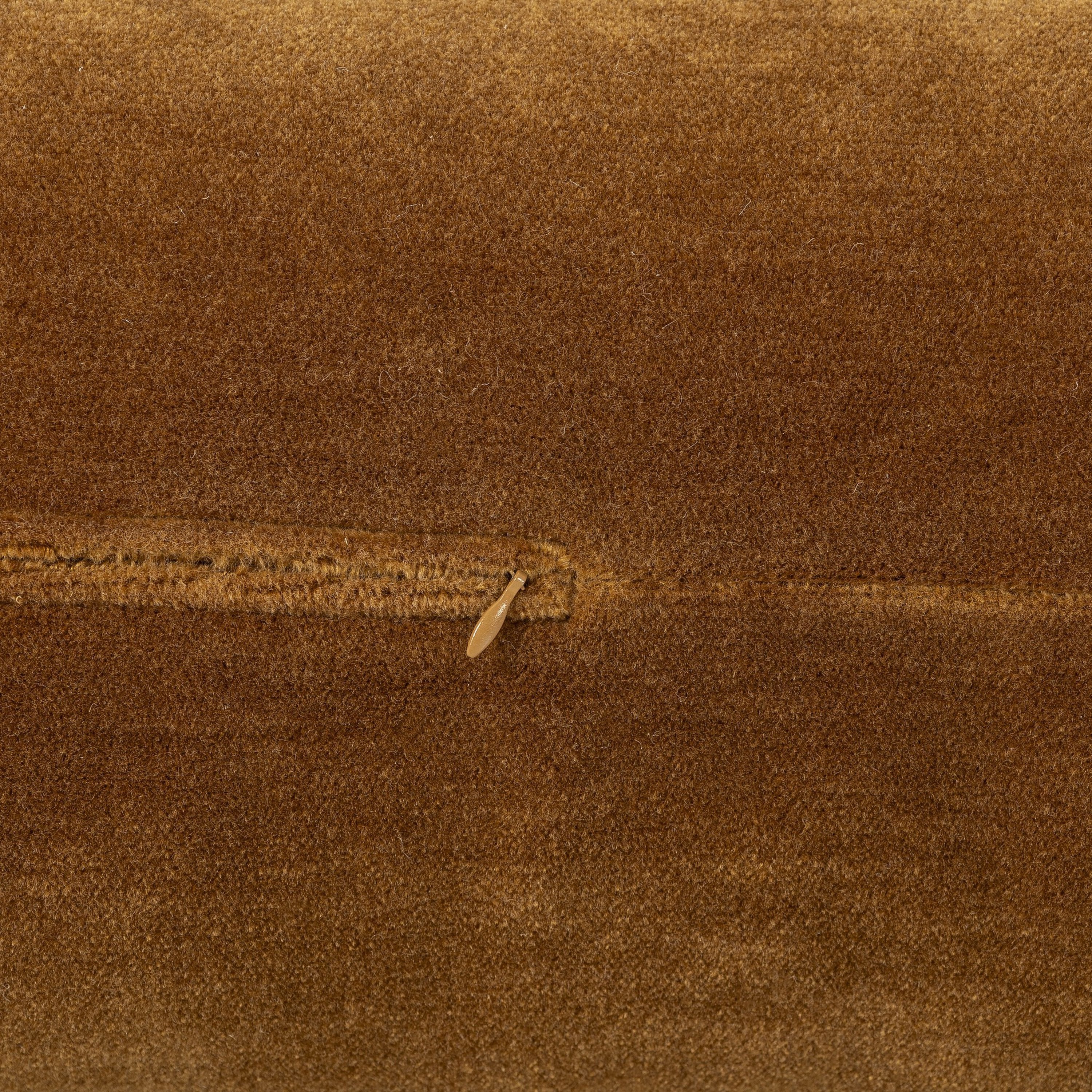 Close-up of brown textured fabric with a zipper