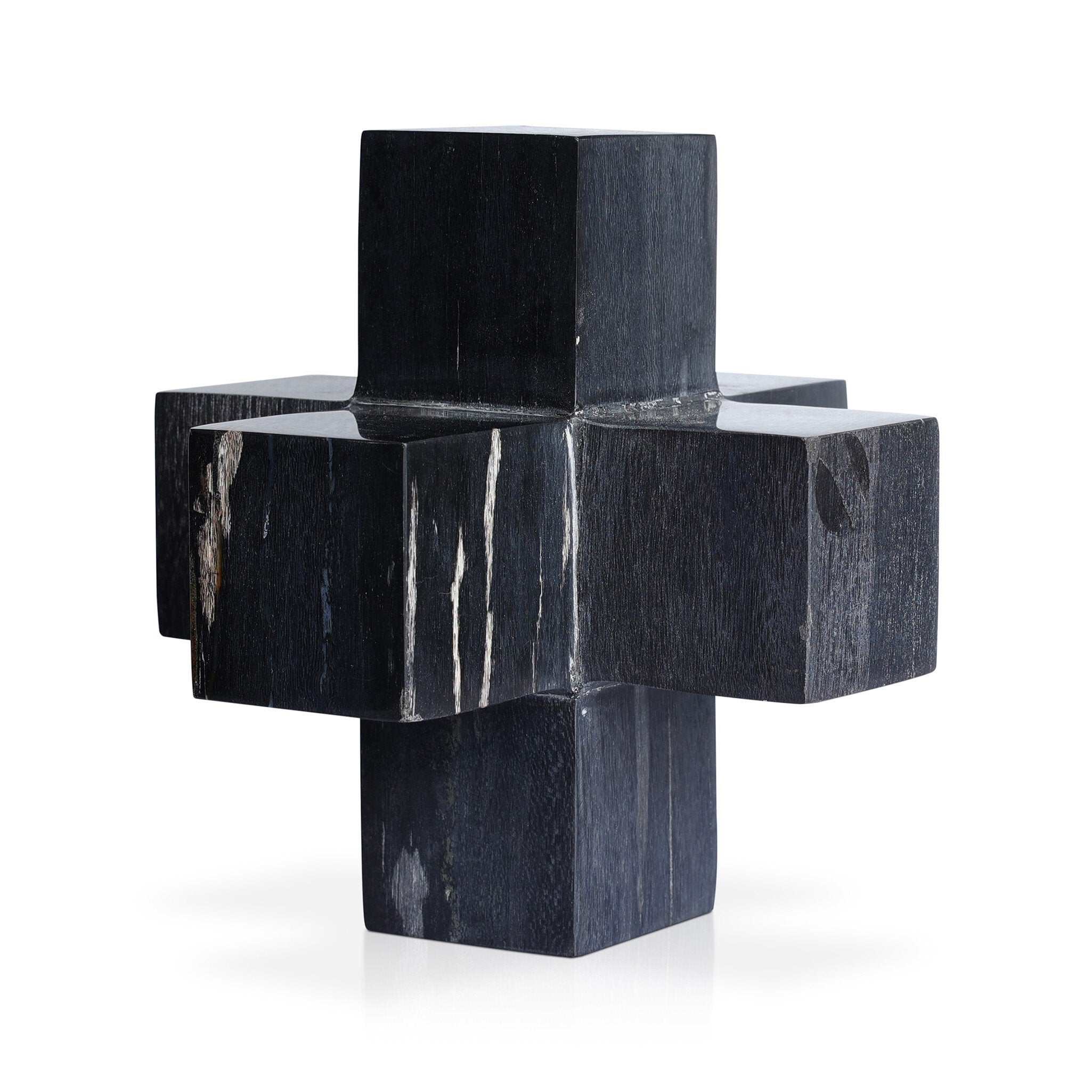 Dark wood geometric sculpture on a white background