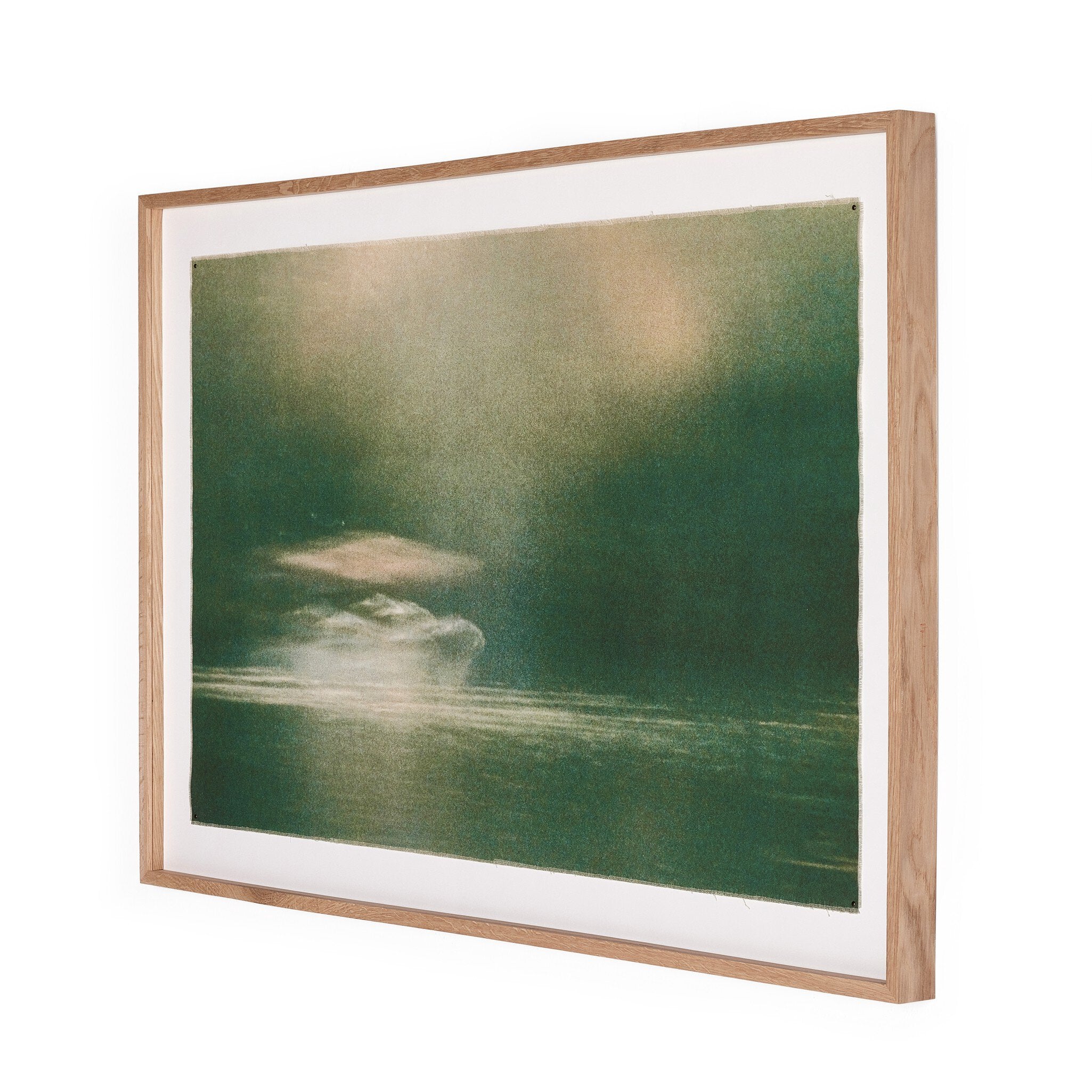 Framed artwork with a dark green landscape and light brown frame on a white background