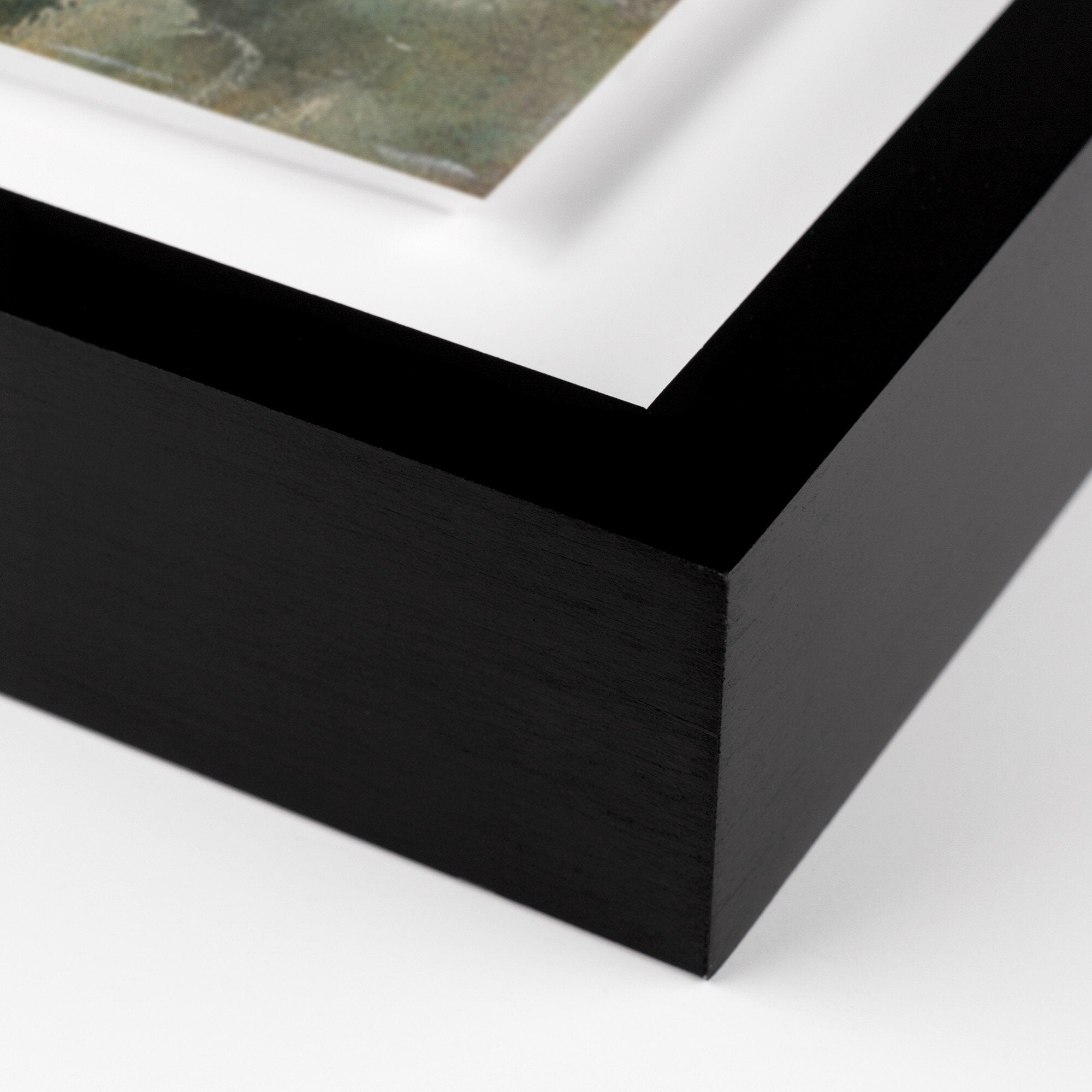 Close-up of a black framed picture on a white background