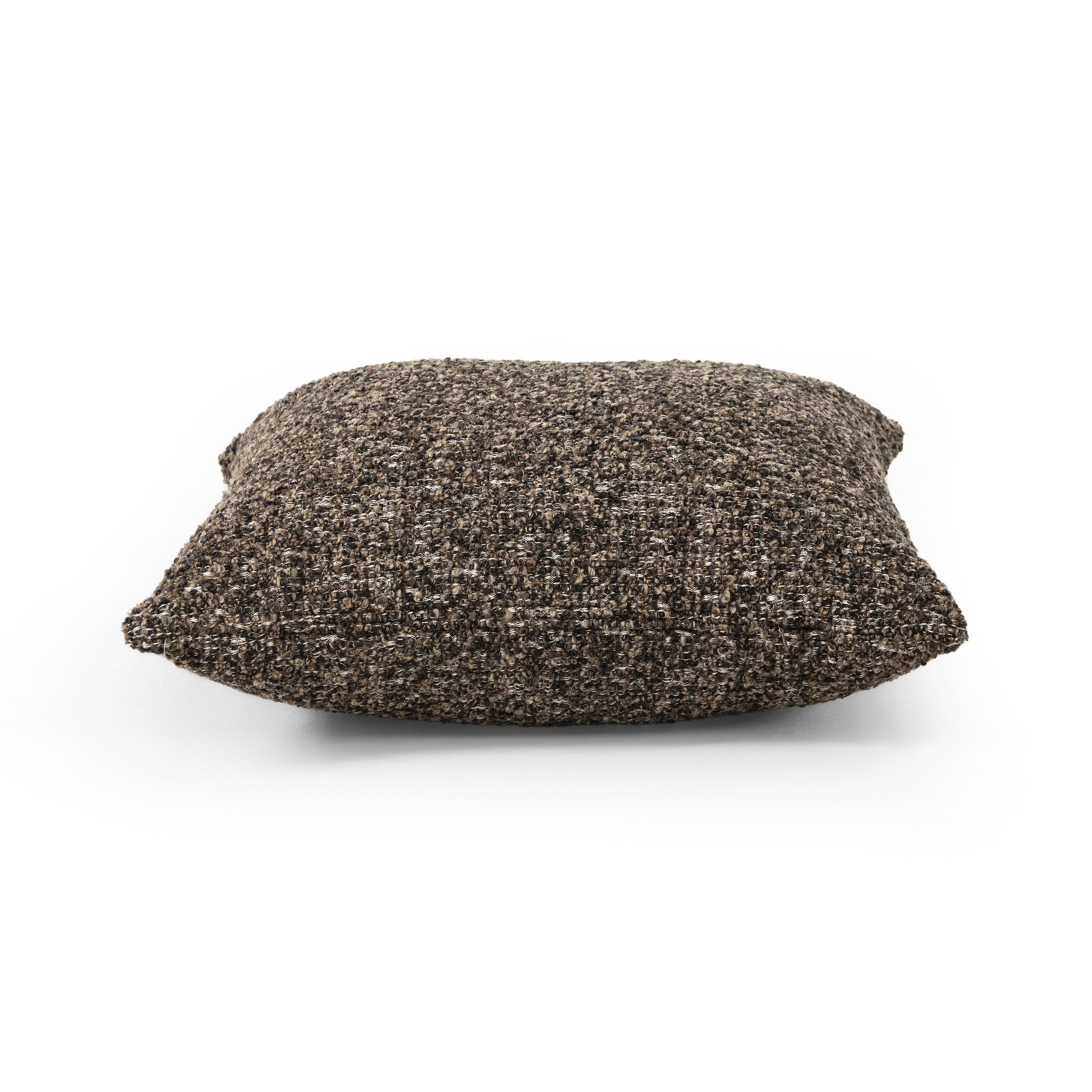 Textured brown pillow on a white background