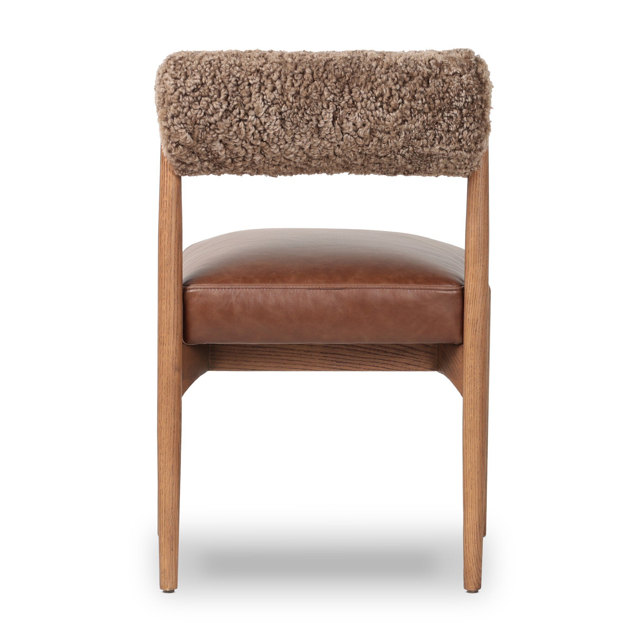 Chair with brown leather seat and sheepskin backrest on a white background
