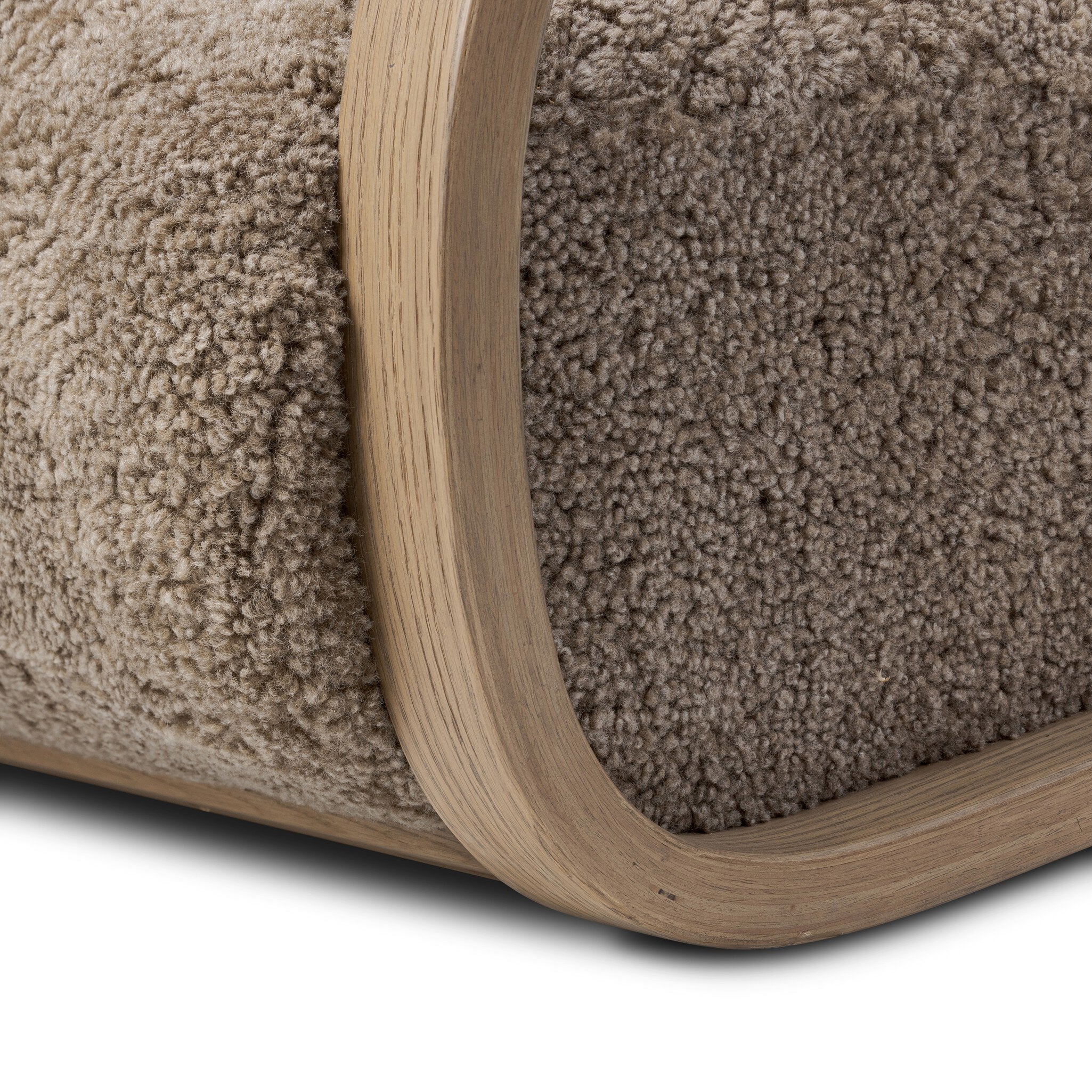 Close-up of a brown textured rug with a wooden border on a white background