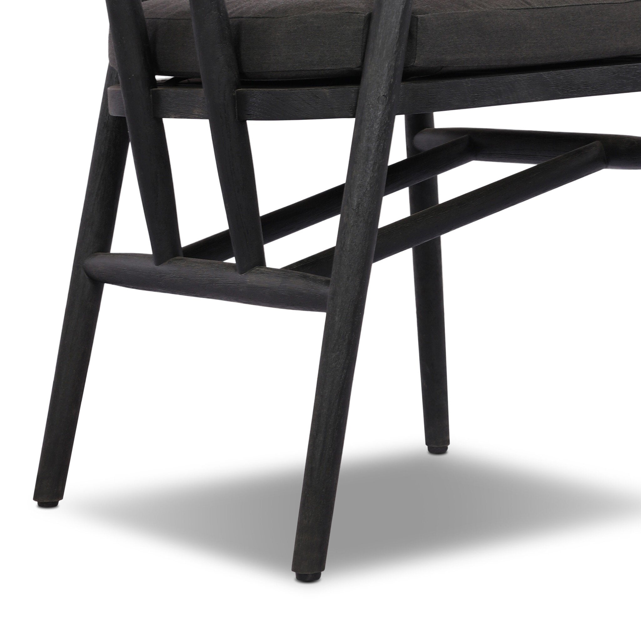 Close-up of a black chair with a white background