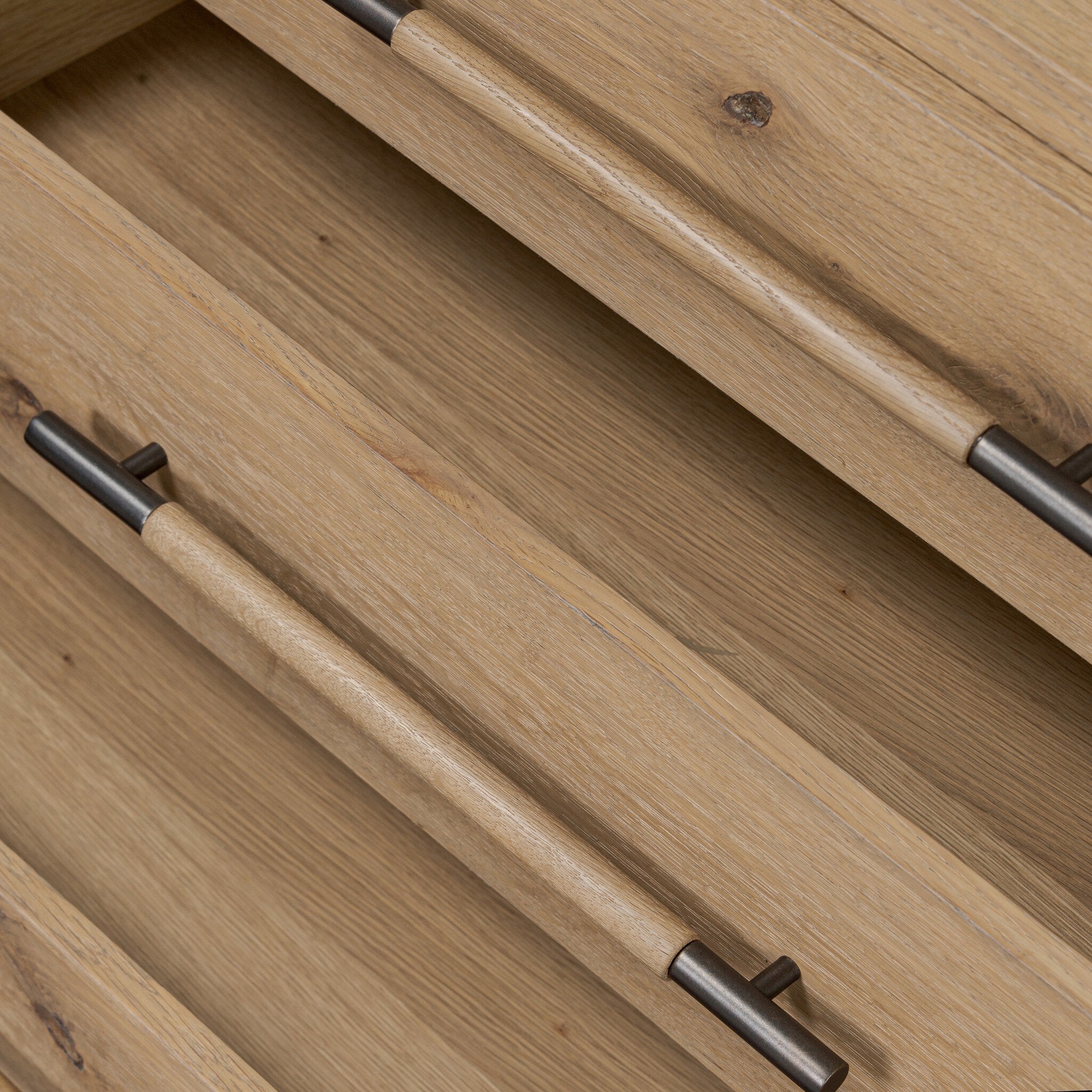 Close-up of wooden drawers with metal handles