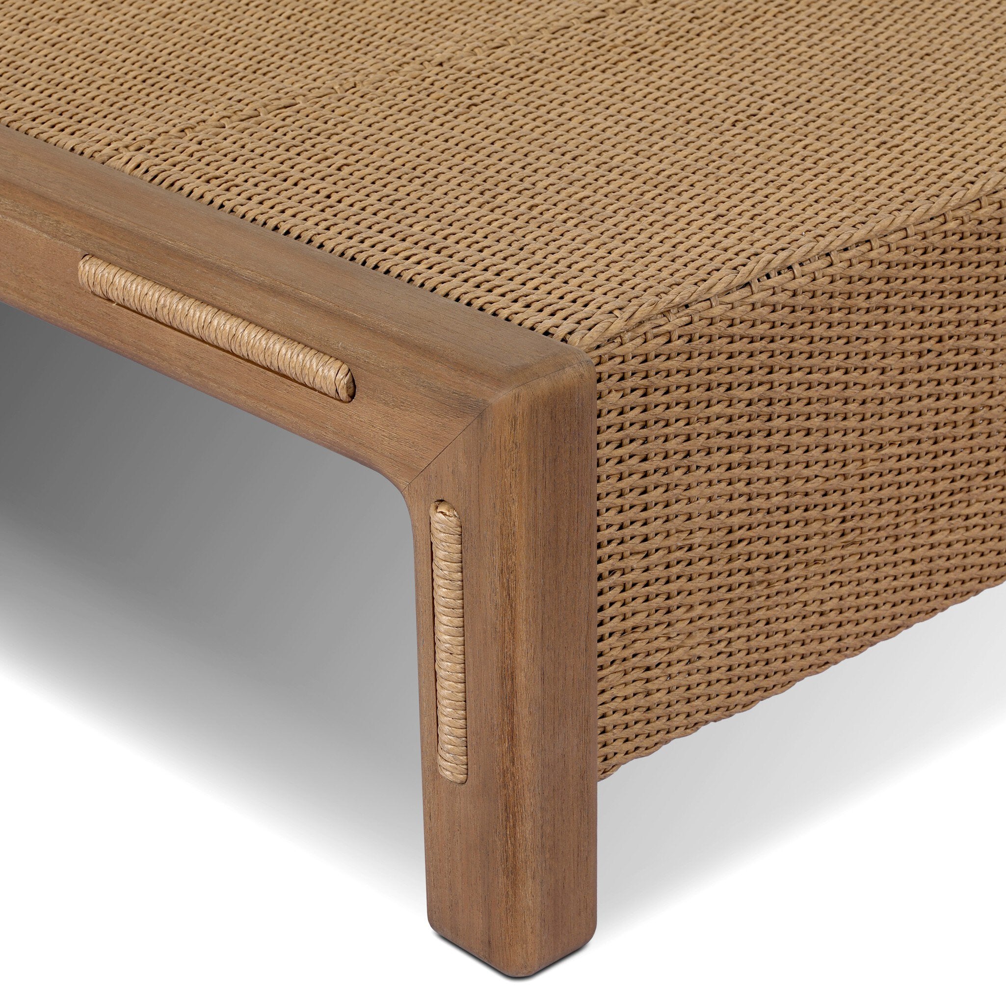 Close-up of a woven outdoor furniture piece with wooden frame