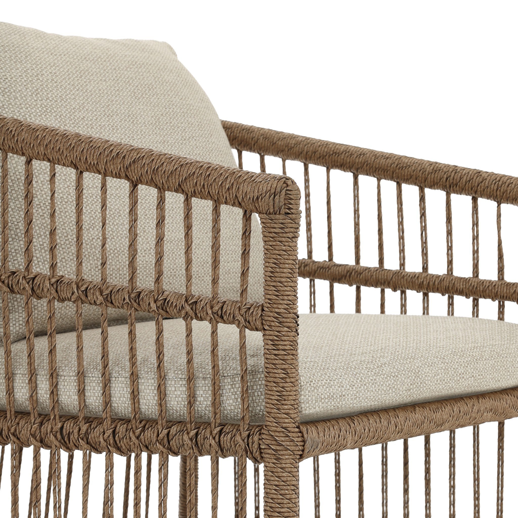 Wicker chair with beige cushion on a white background