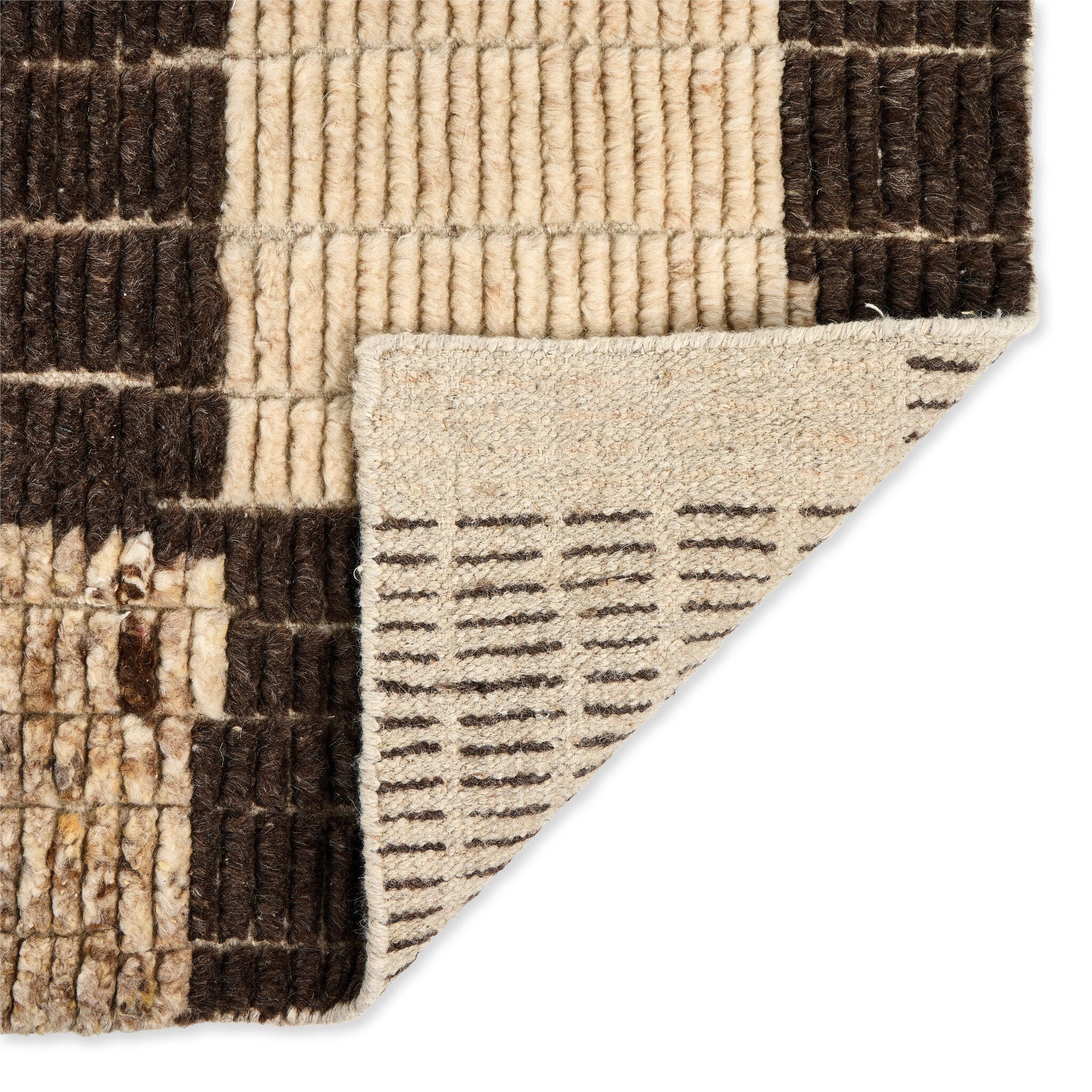 Close-up of a textured rug with brown and beige pattern