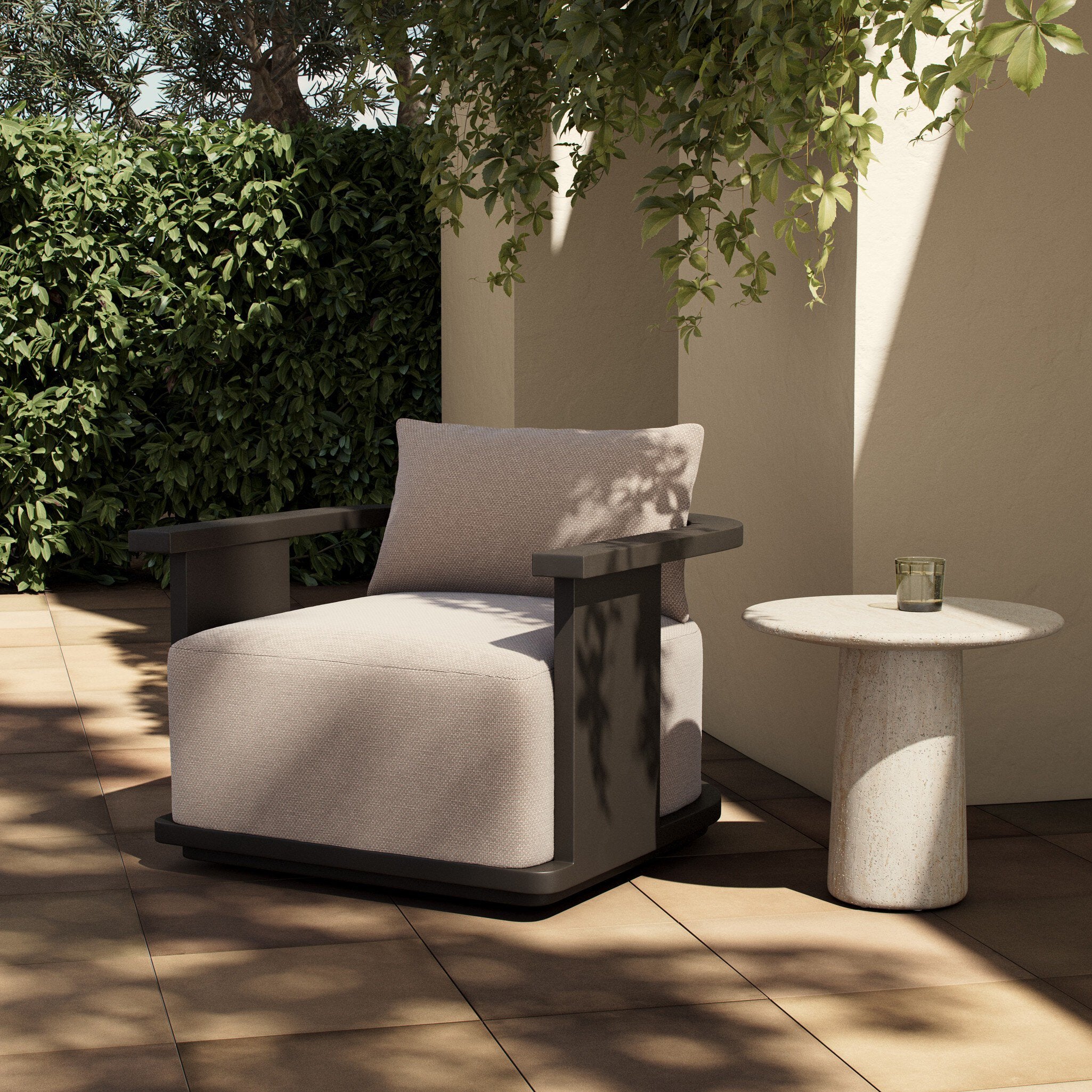 Modern outdoor chair with a side table in a garden setting