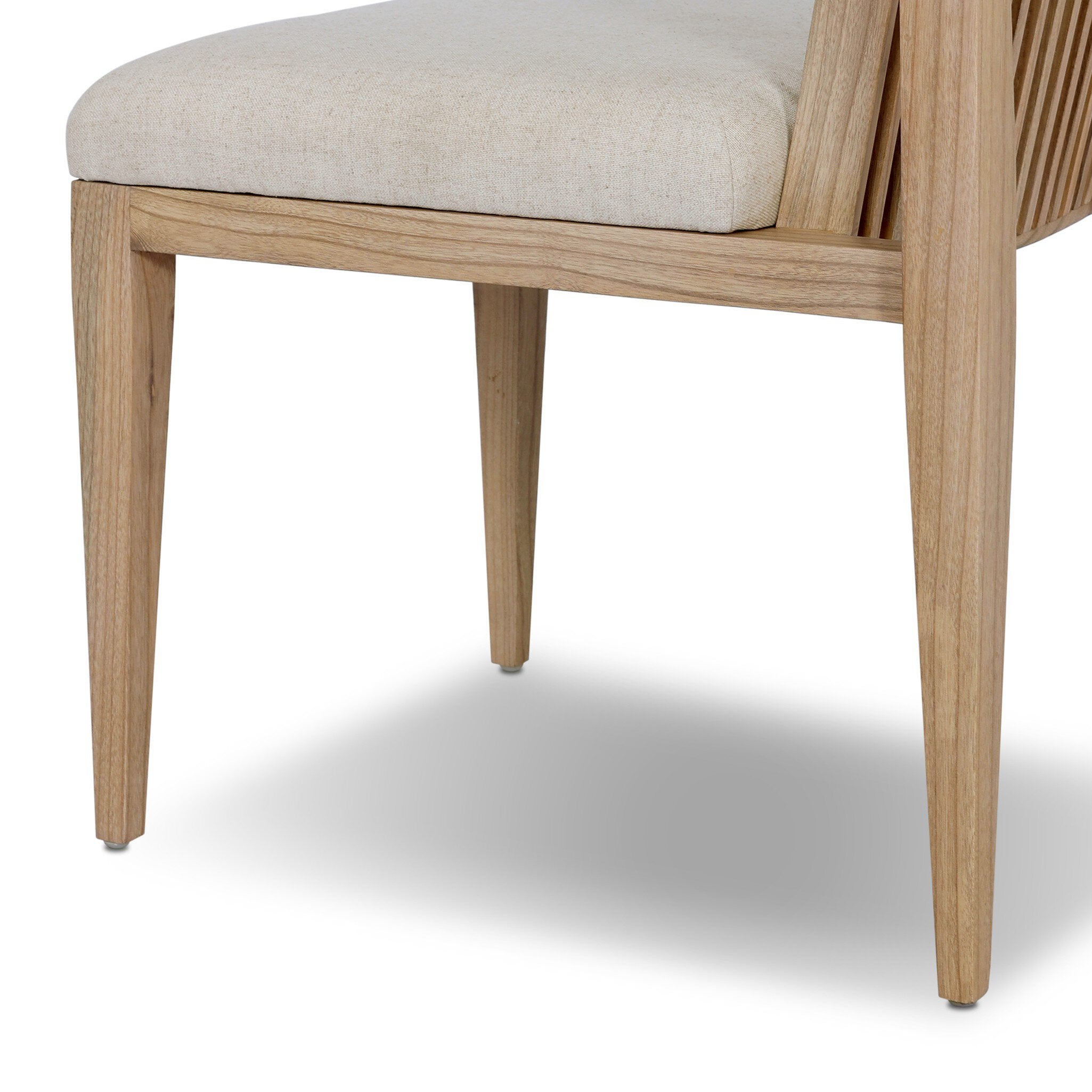 Wooden chair with a beige cushion on a white background