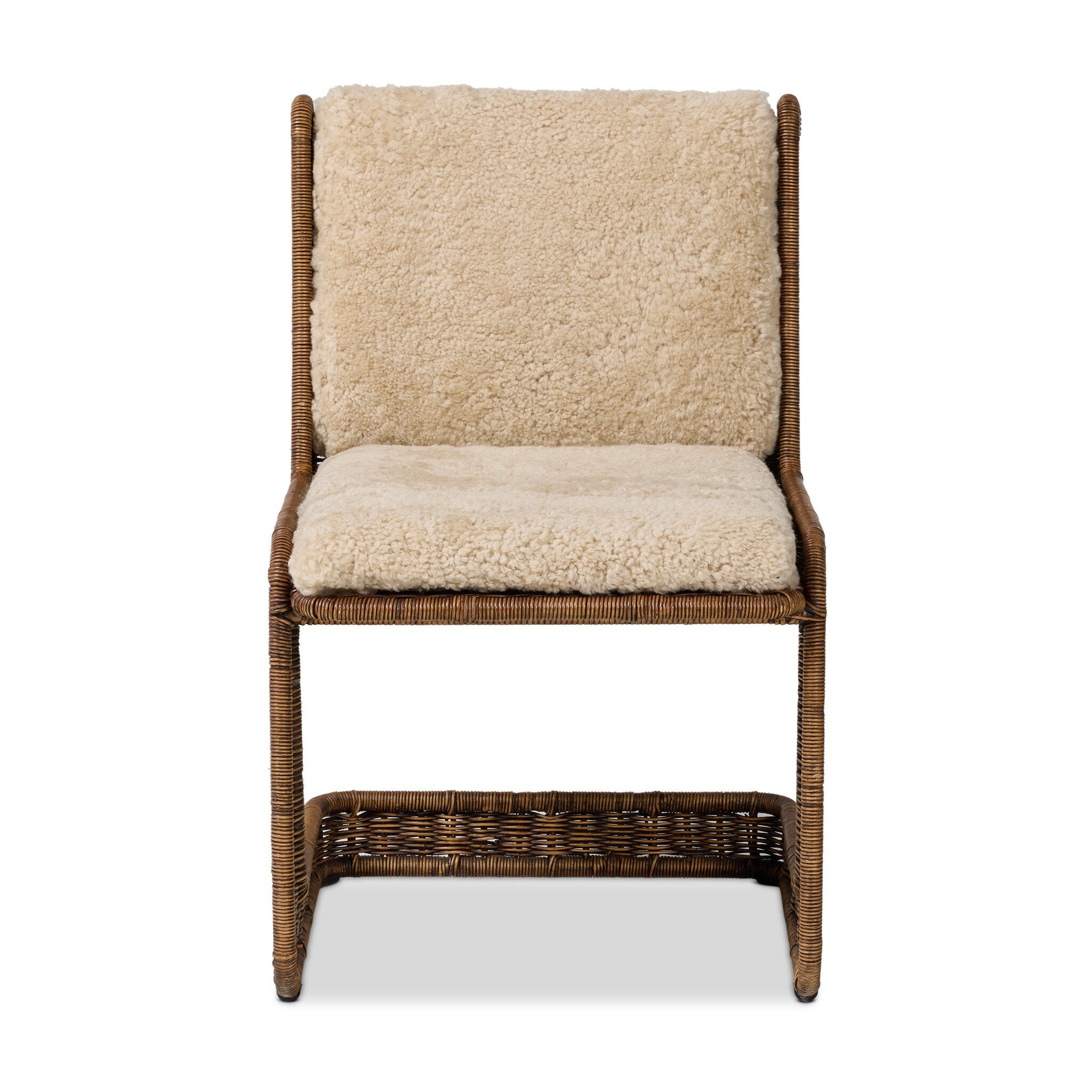 Chair with wicker frame and beige shearling cushion on a white background