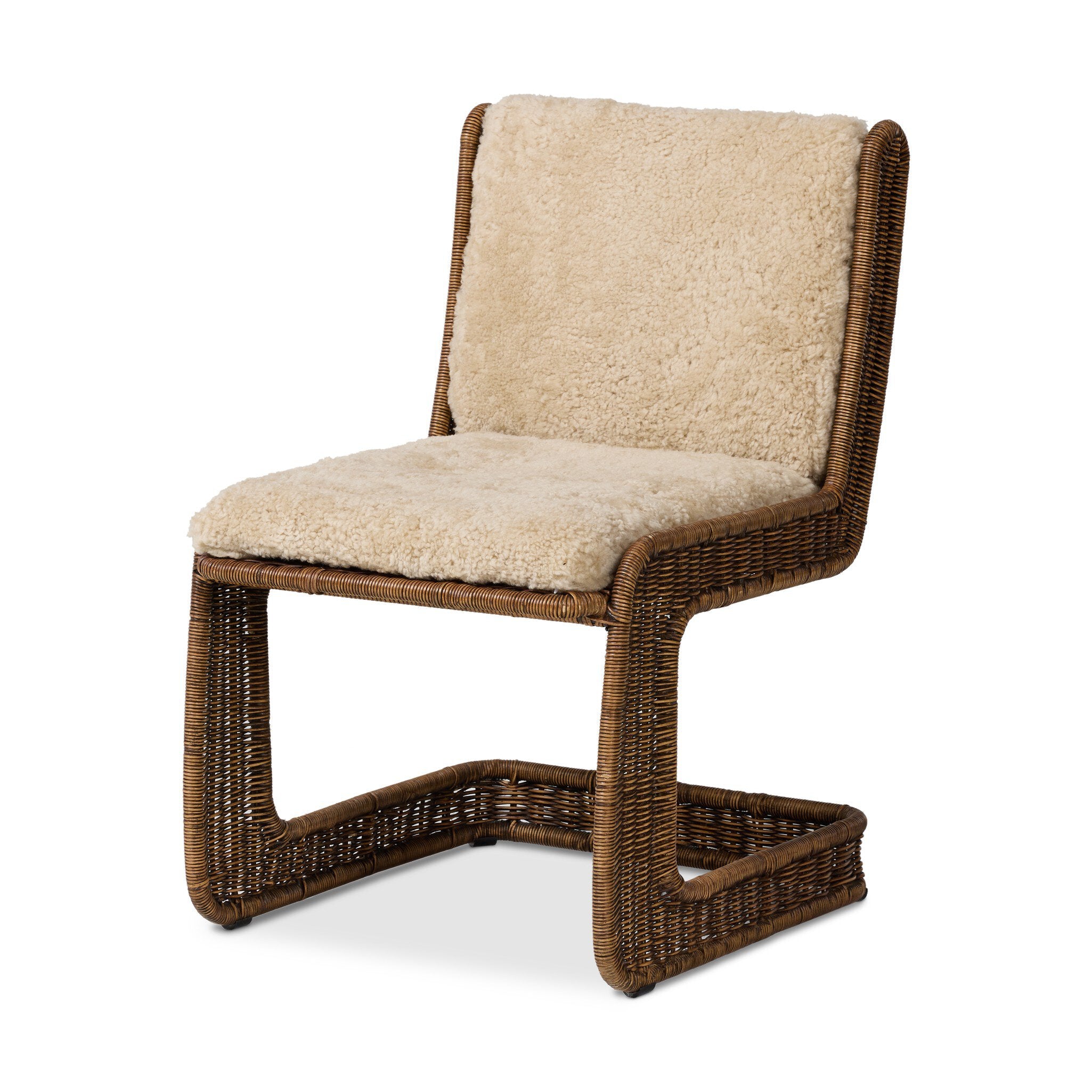 Chair with wicker frame and beige cushion on a white background
