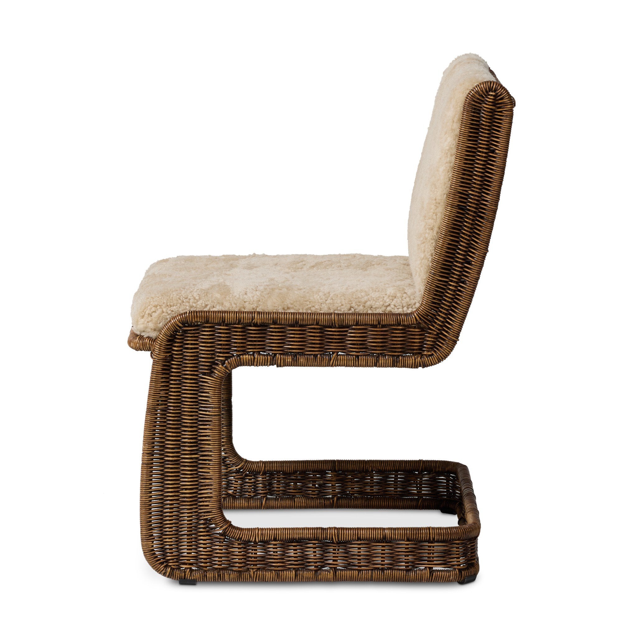 Wicker chair with beige cushion on a white background