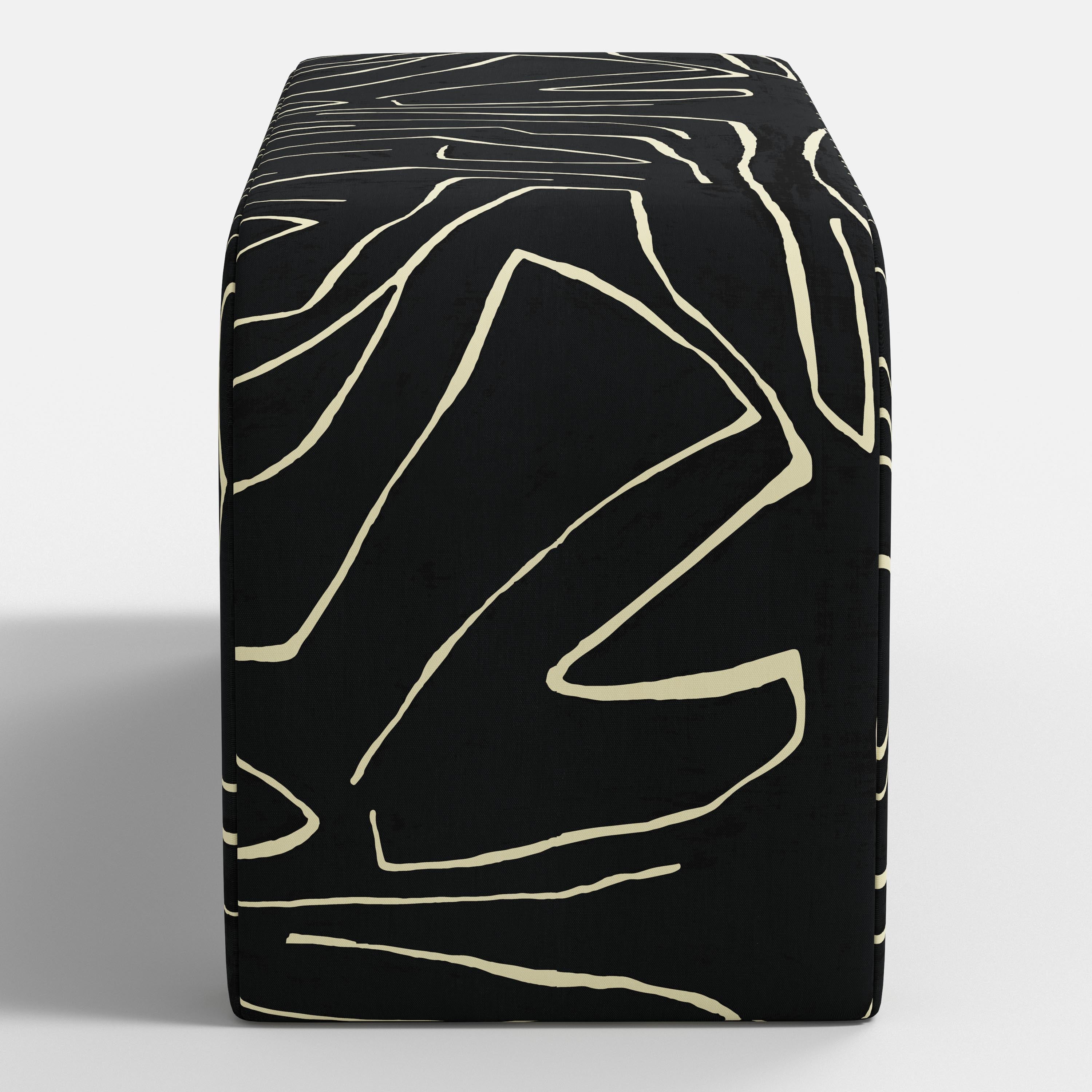 Black bench with geometric pattern on a white background