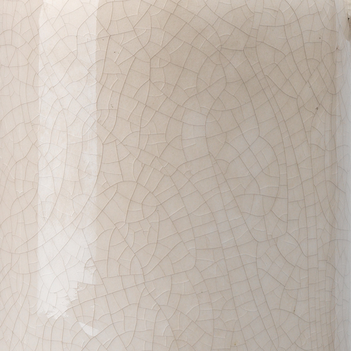 Close-up of a ceramic vase with a crackled glaze texture.