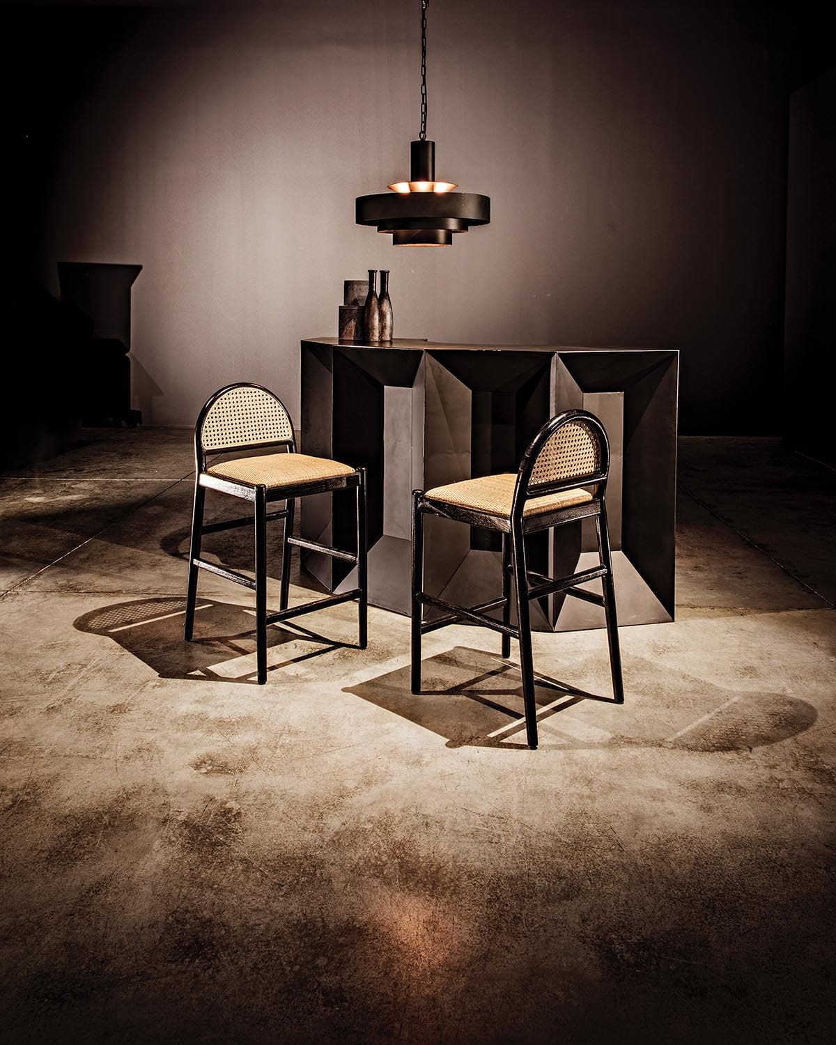 Modern counter stool with caned half-moon back and rattan seat