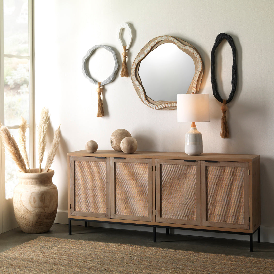 Round mirror with a textured brown frame on a white background
