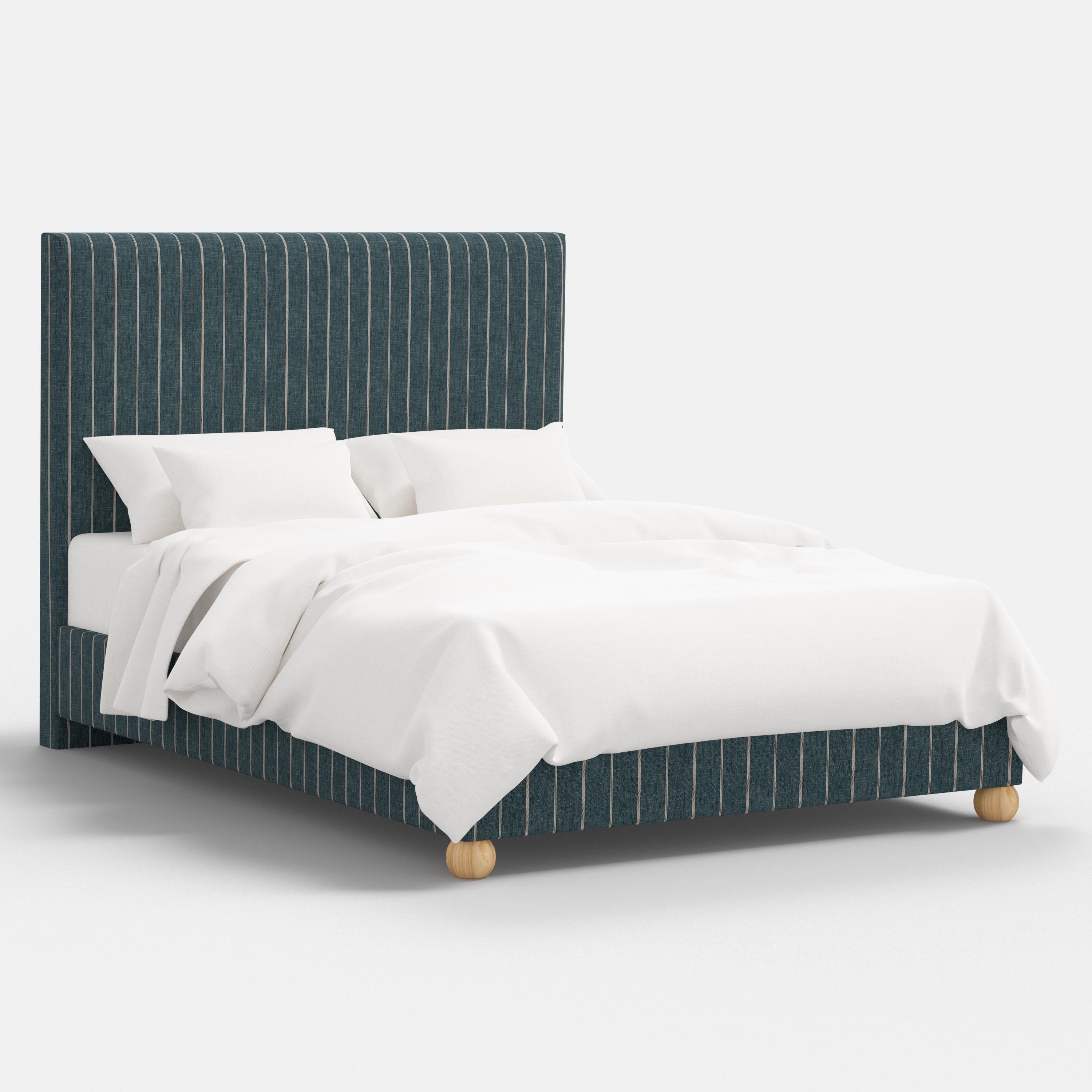 Bed with white bedding and a striped headboard on a white background