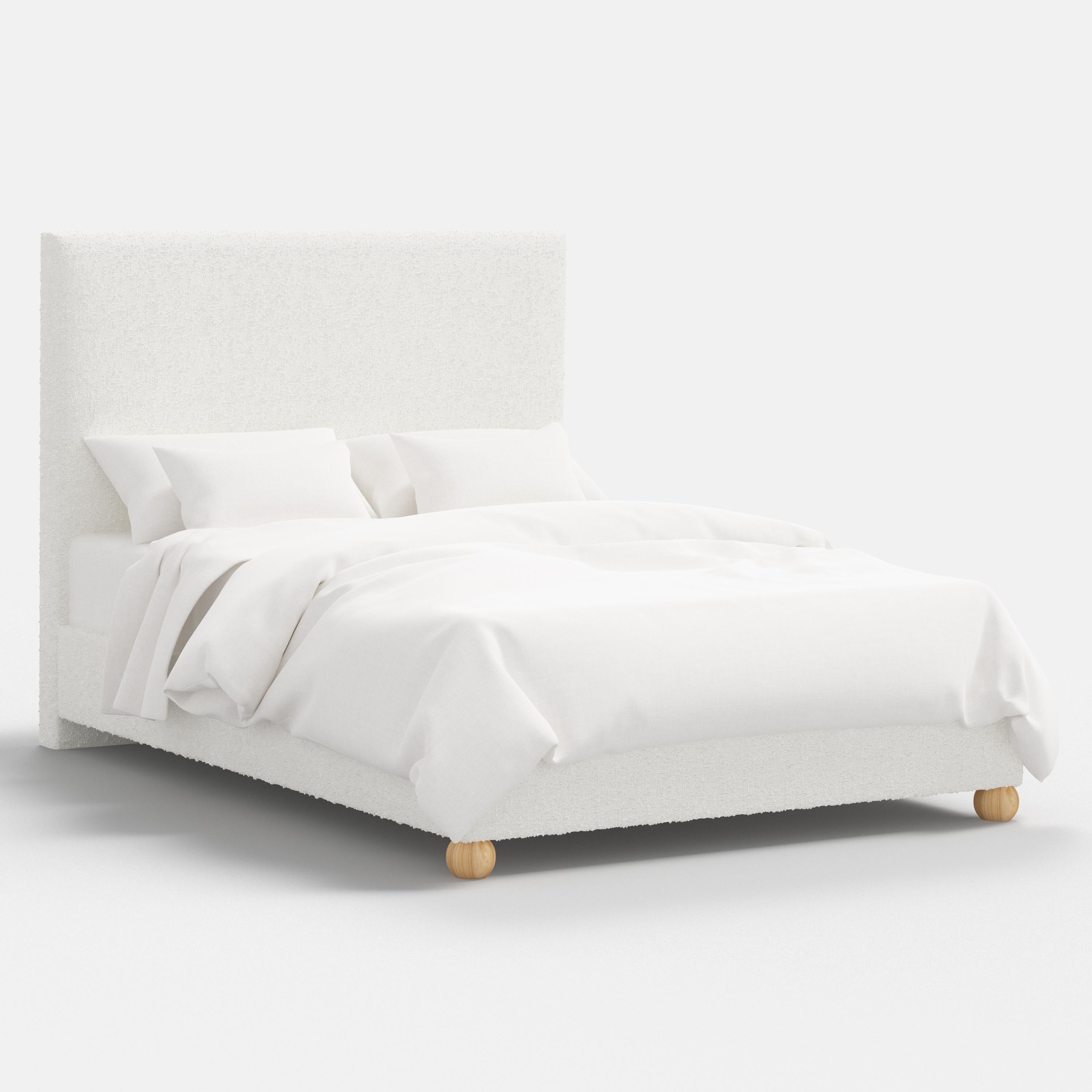 White bed with wooden legs on a white background