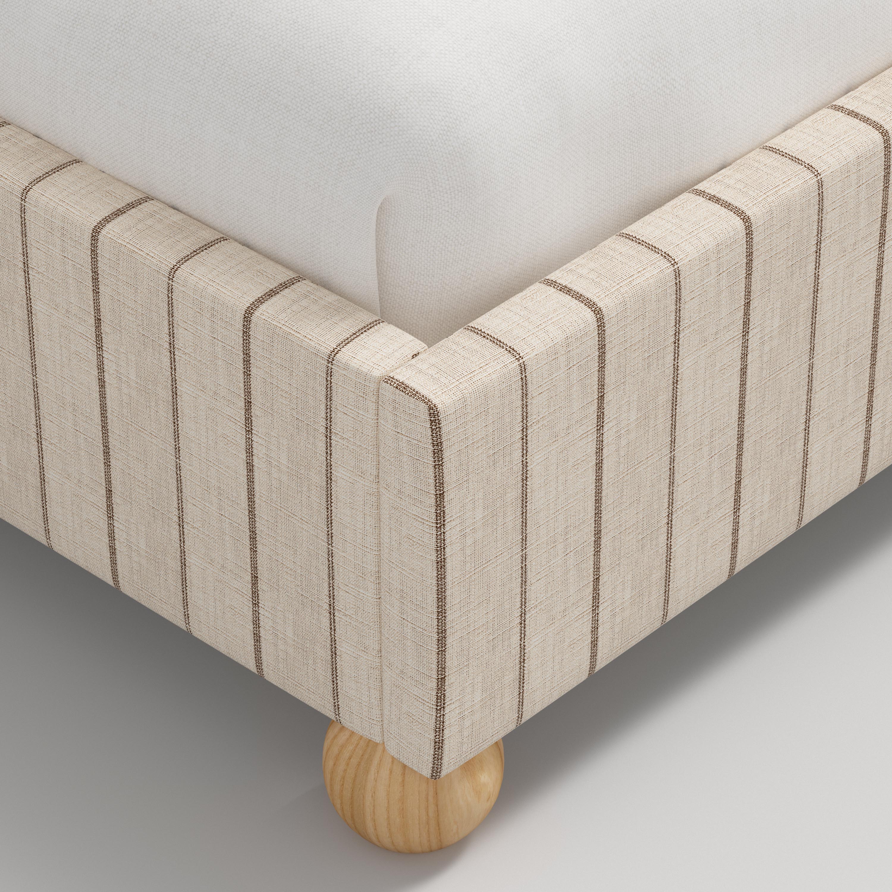 Beige bed with white bedding on a white background