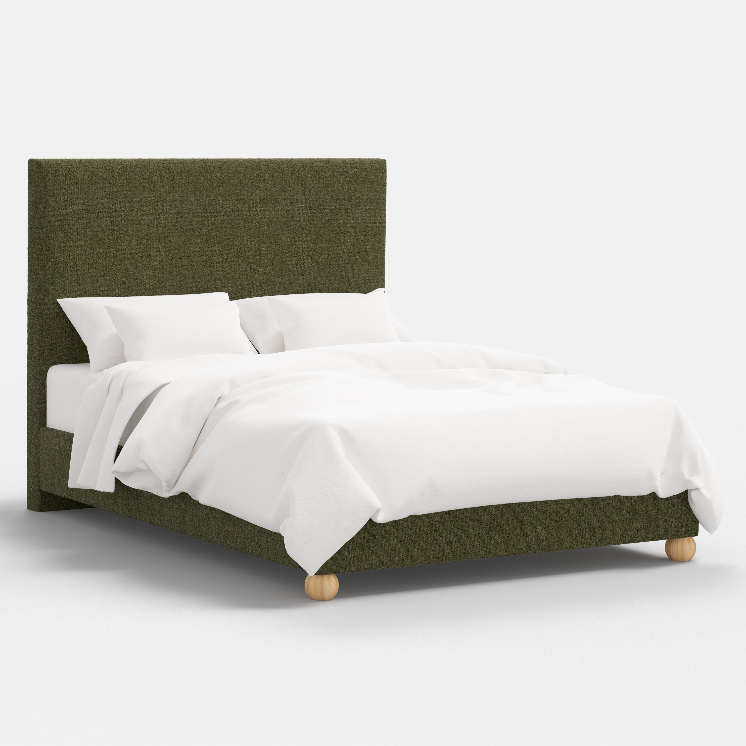 Bed with green upholstered headboard and white bedding on a white background