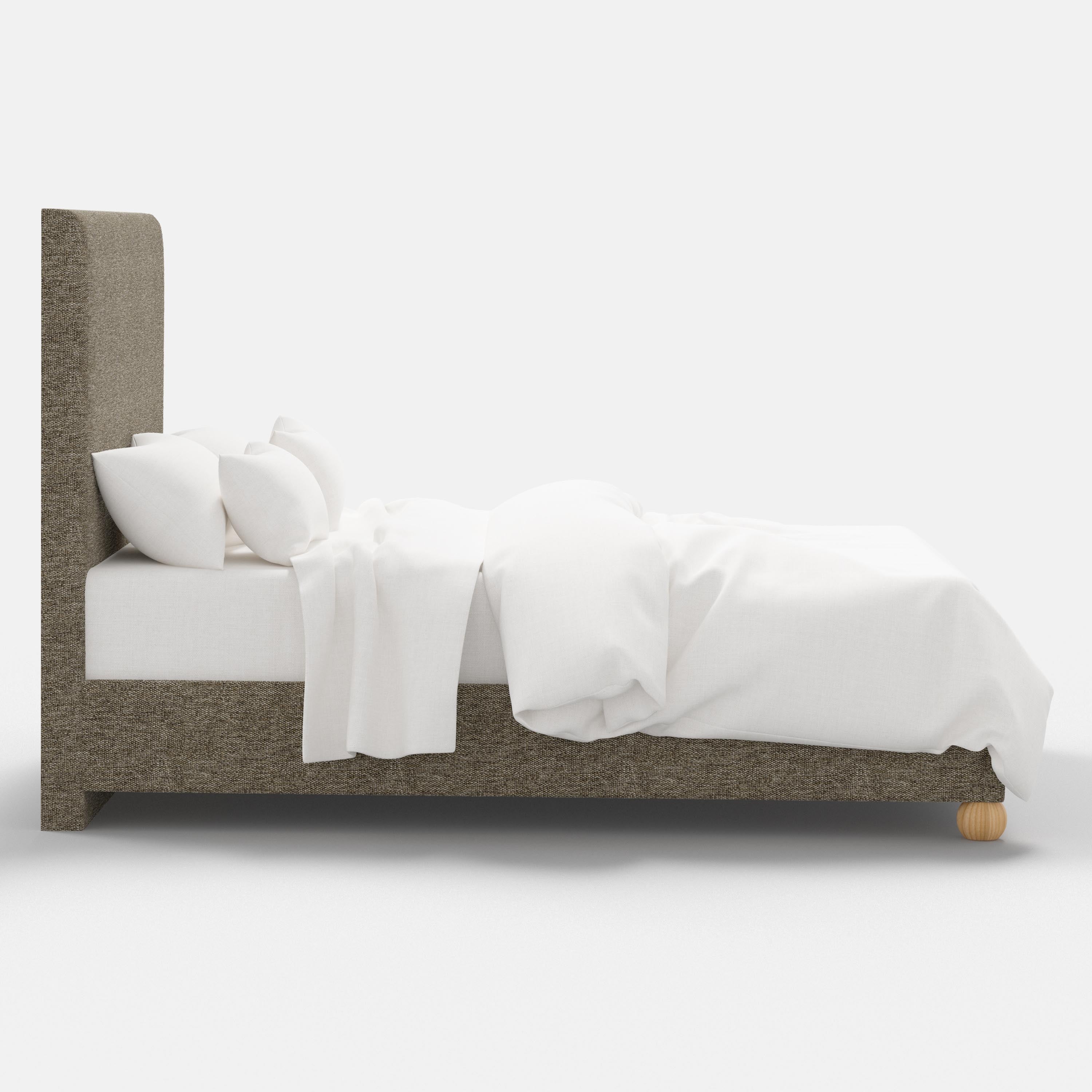 Bed with gray upholstered headboard and white bedding on a white background