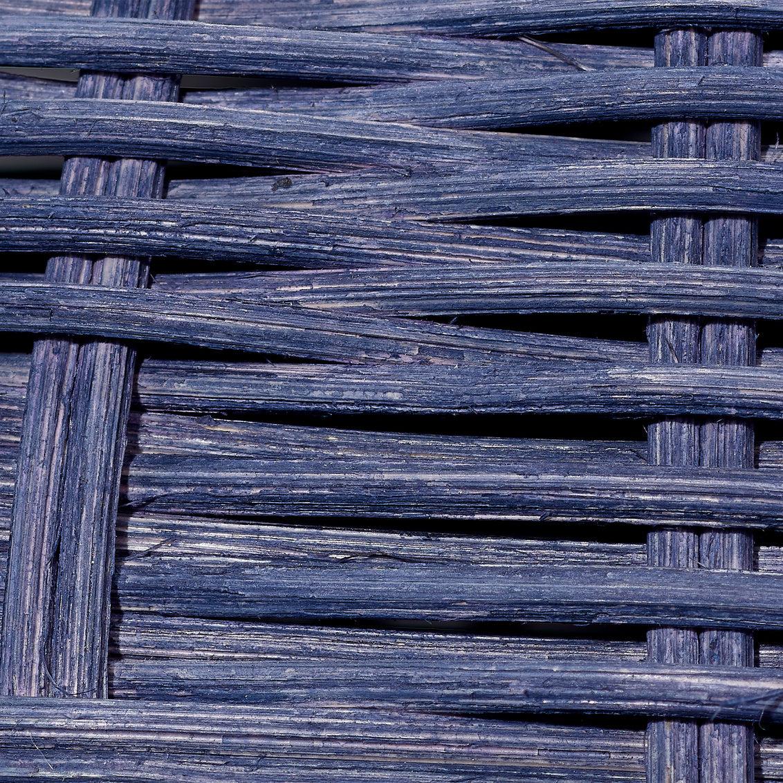 Close-up of woven dark blue rattan table lamp