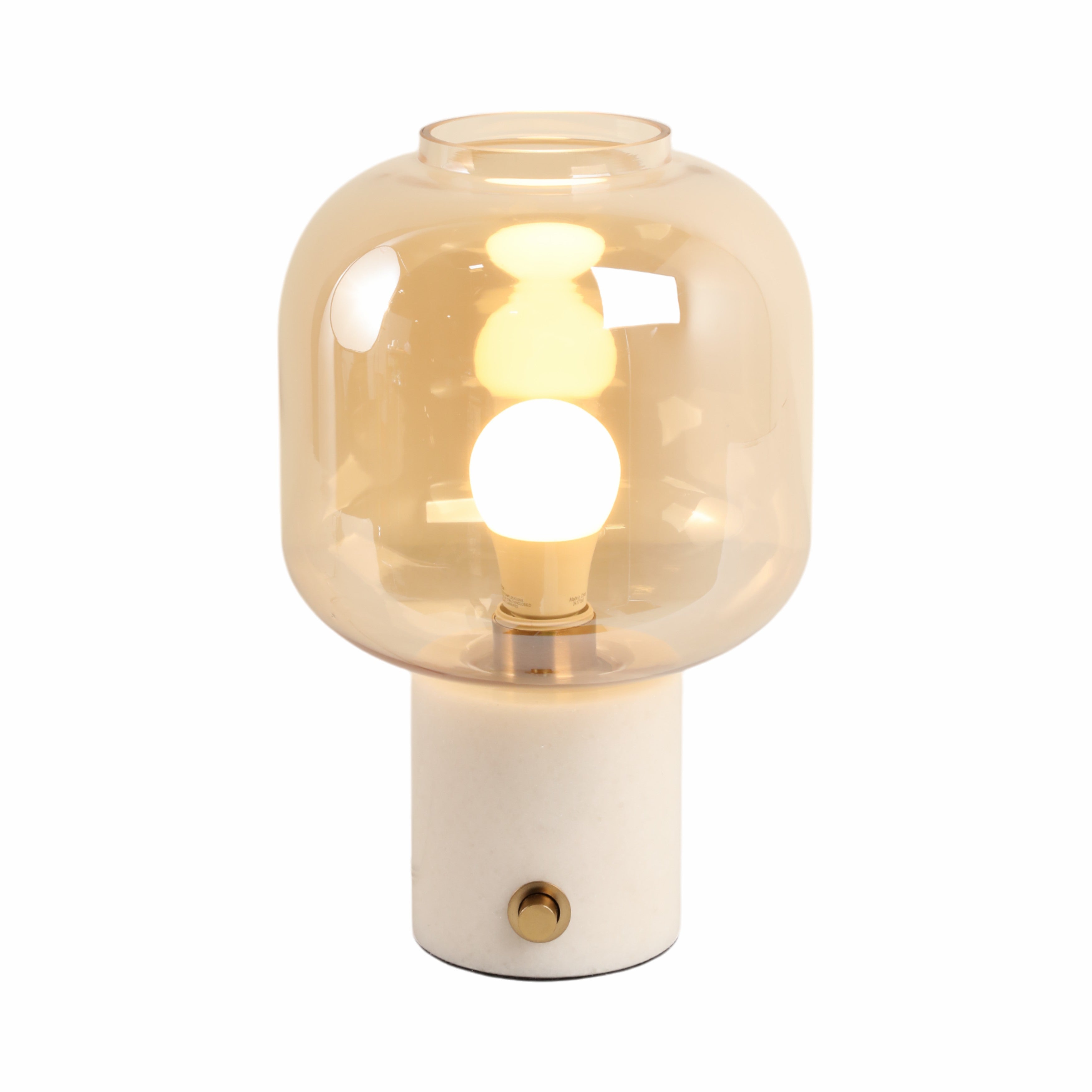 Table lamp with a glass shade and white base on a white background