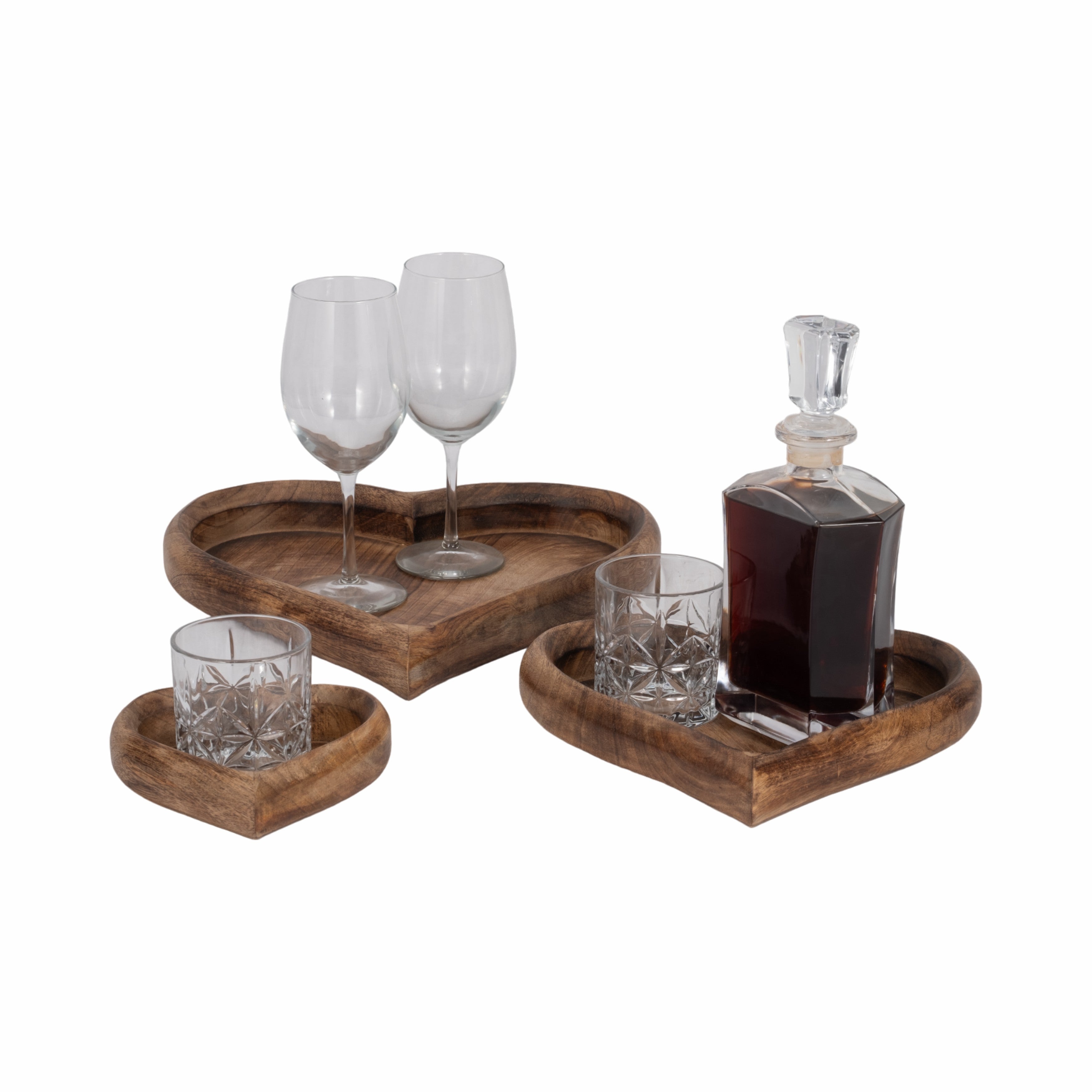 Wooden tray set with glasses and a decanter on a white background