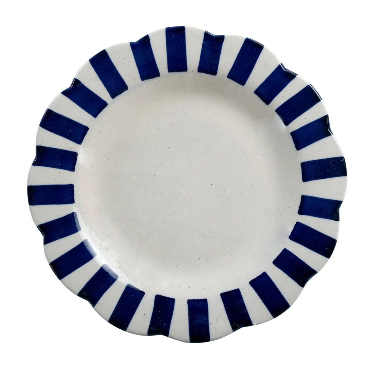 White plate with blue striped rim on a white background