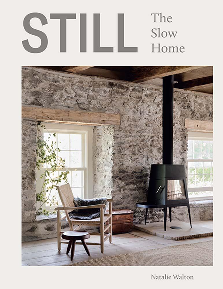 Book cover of 'The Slow Home' by Natalie Walton with a rustic interior design.