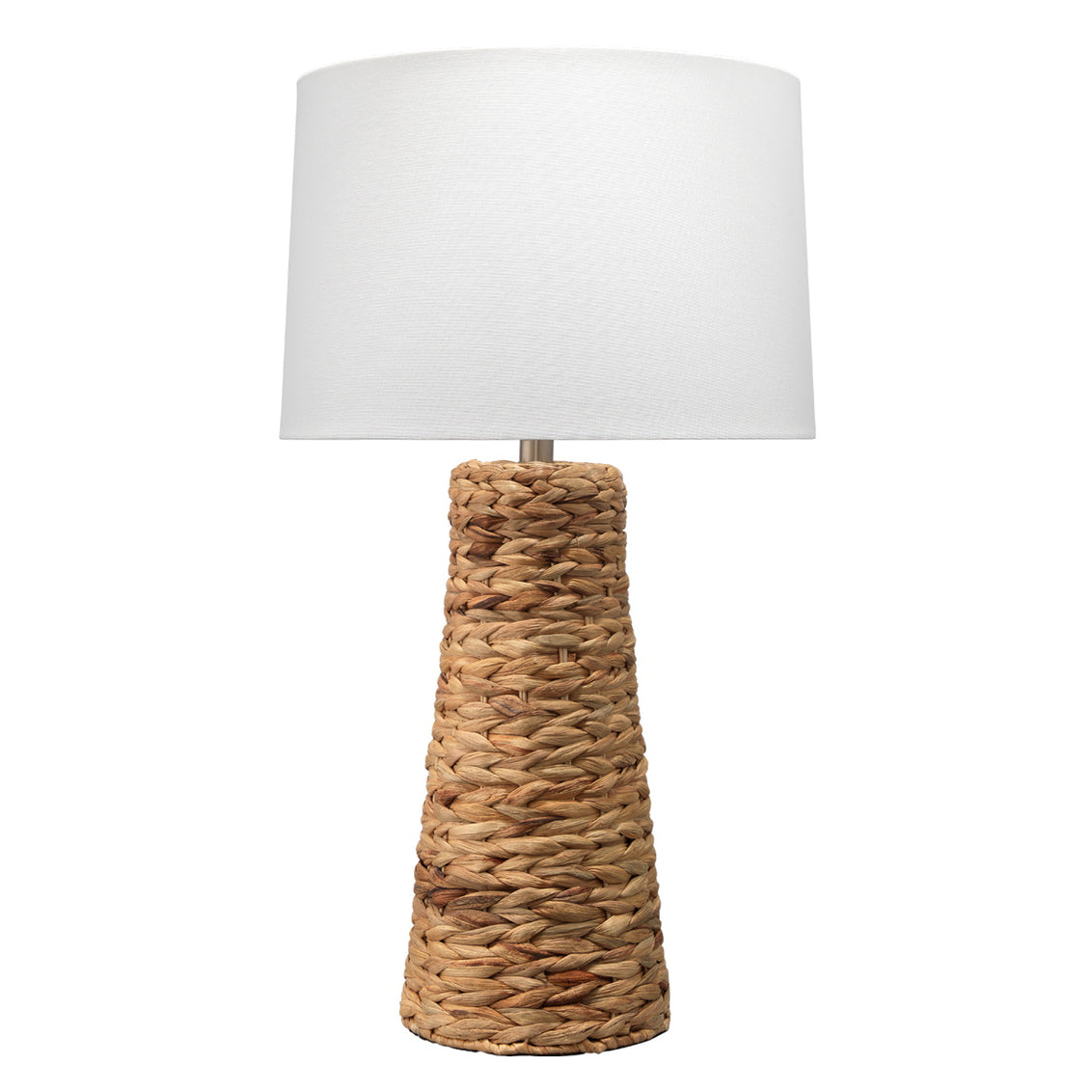 Table lamp with wicker base and white shade on a white background