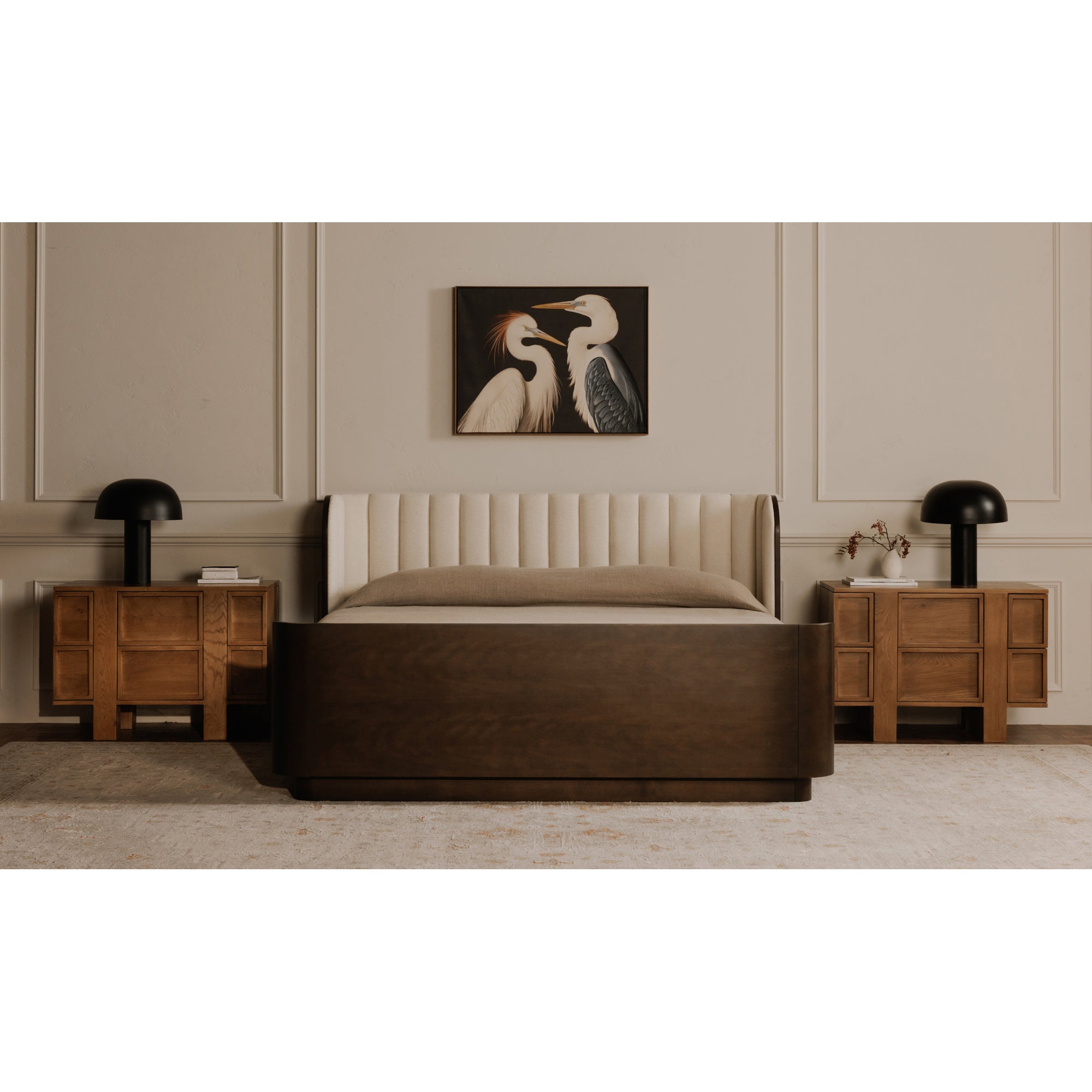 Modern bedroom with a bed, nightstands, and wall art.