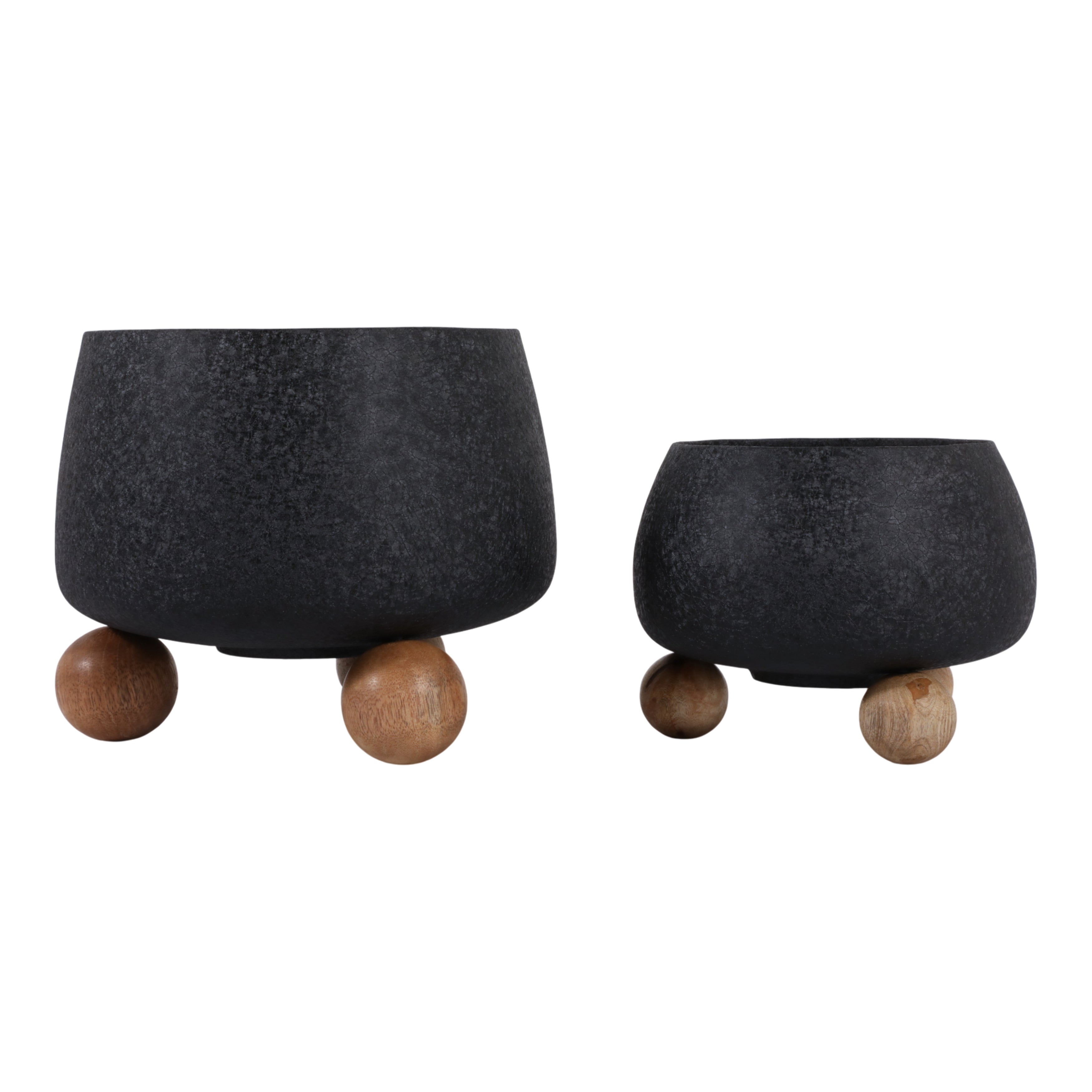Two black planters with wooden feet on a white background