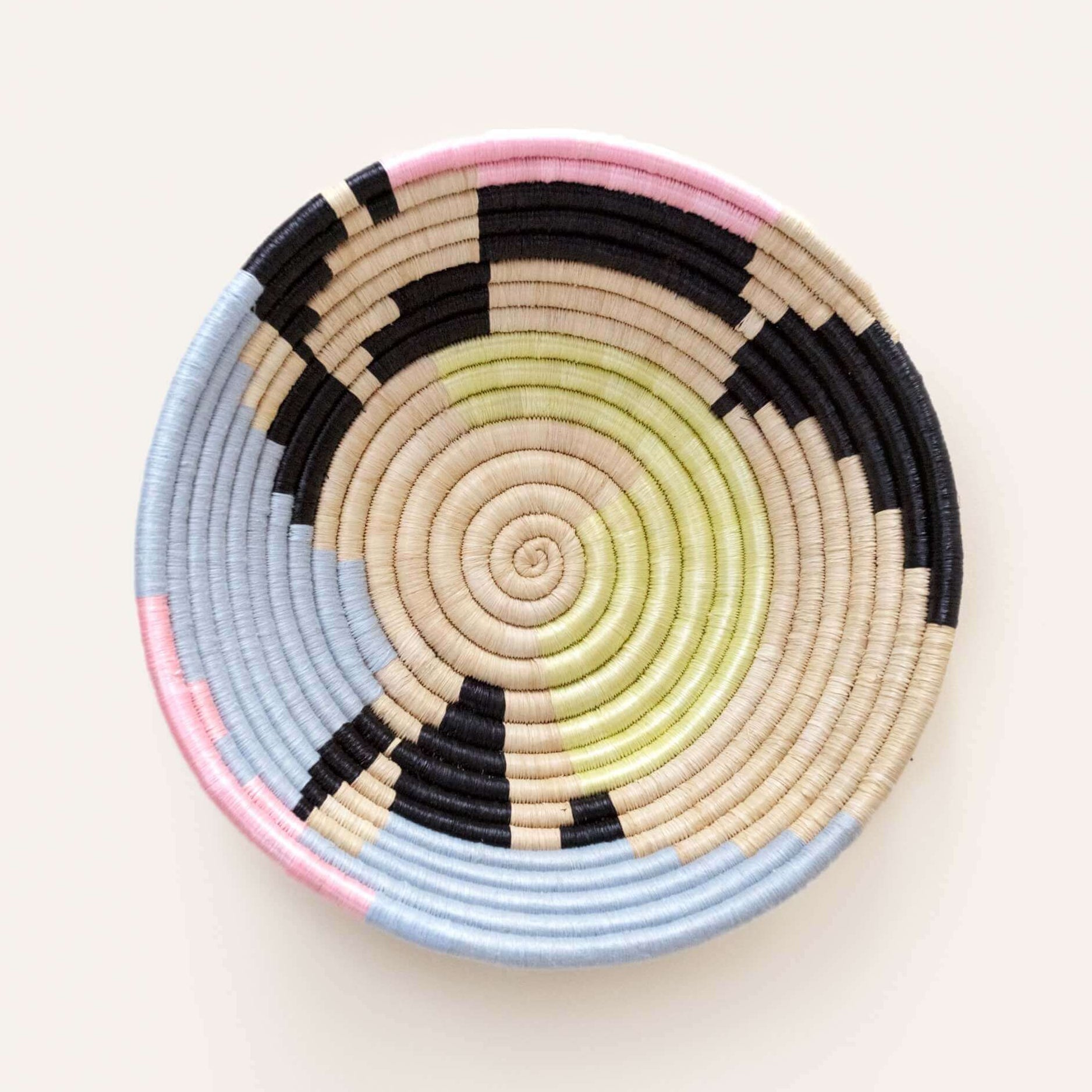 Woven basket with concentric circle pattern on a light background