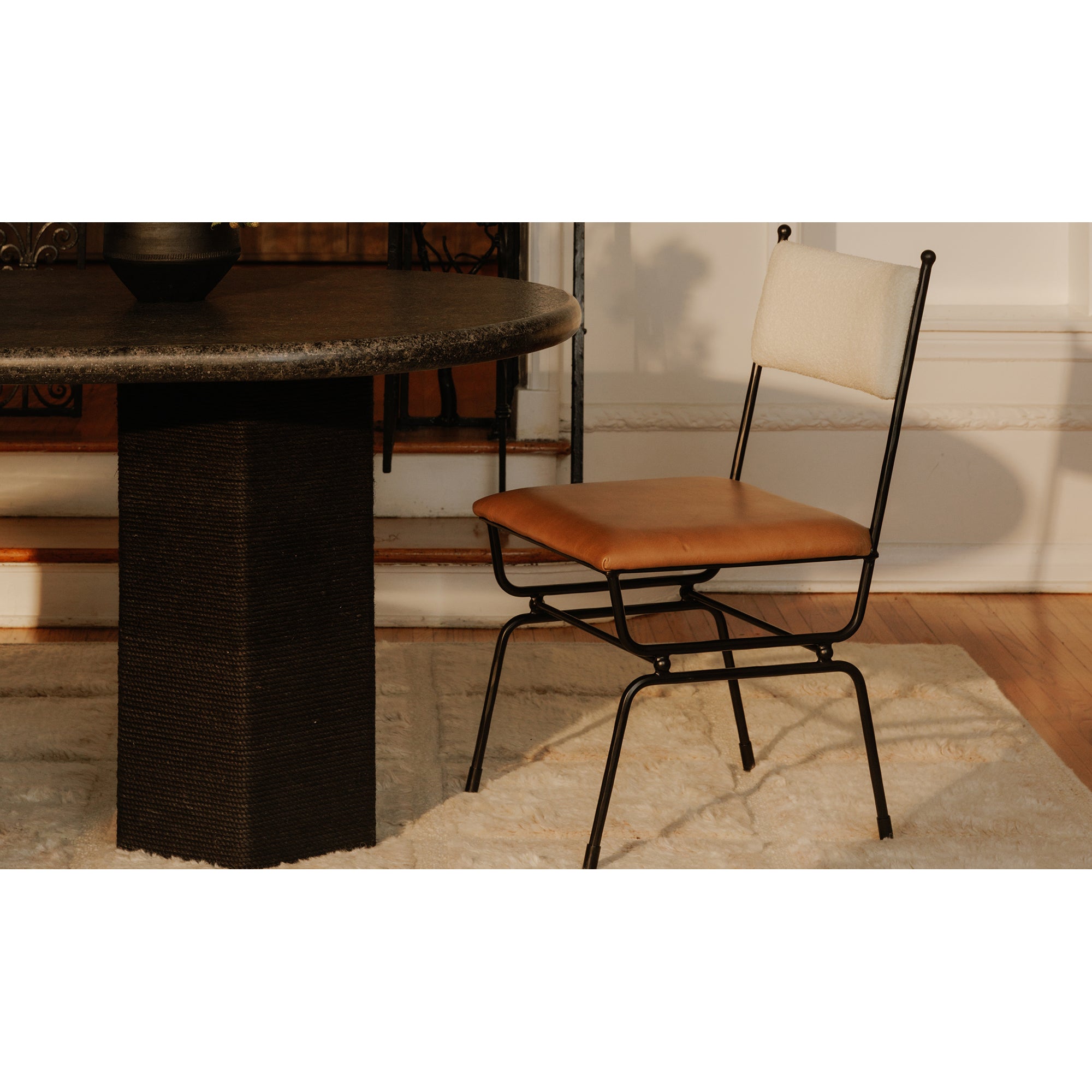 Chair with beige cushioned backrest and brown seat on a white background