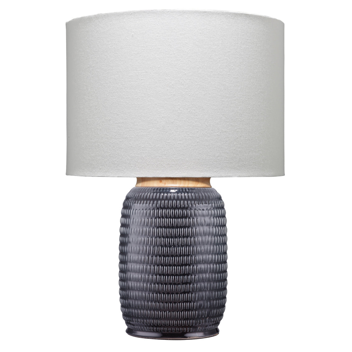 Table lamp with textured gray base and white shade on a white background